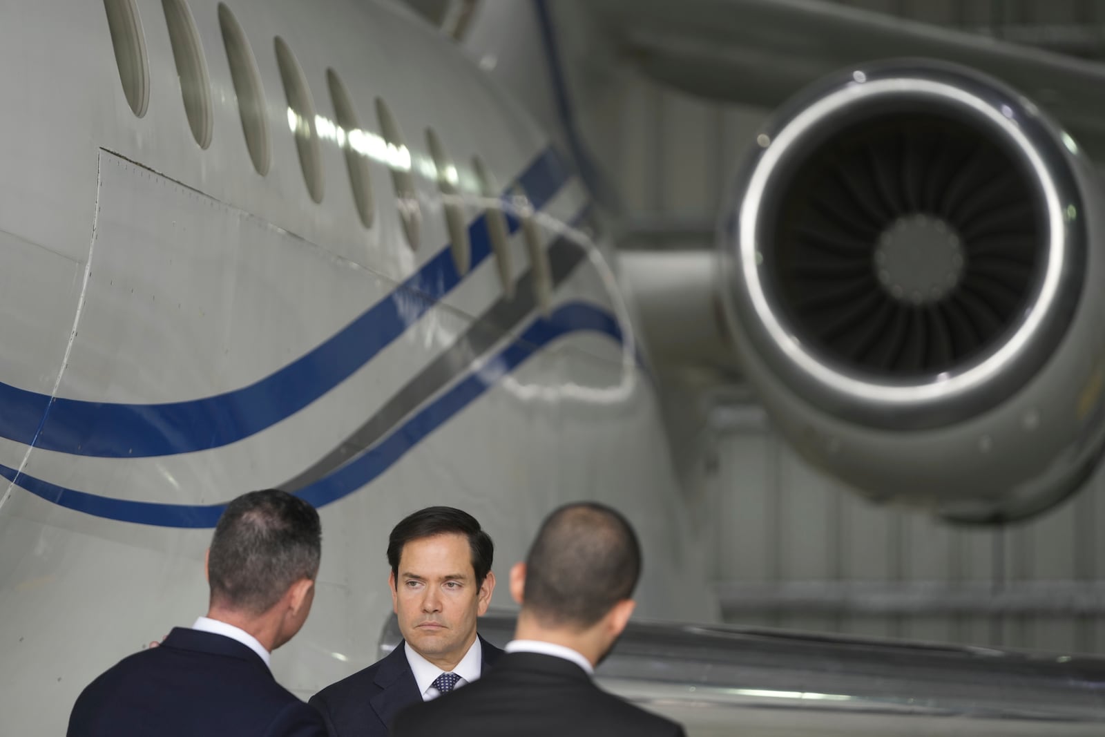 U.S. Secretary of State Marco Rubio stands by the Venezuelan government airplane he announced is being seized by the U.S. during a press conference at La Isabela International Airport in Santo Domingo, Dominican Republic, Thursday, Feb. 6, 2025. (AP Photo/Mark Schiefelbein, Pool)