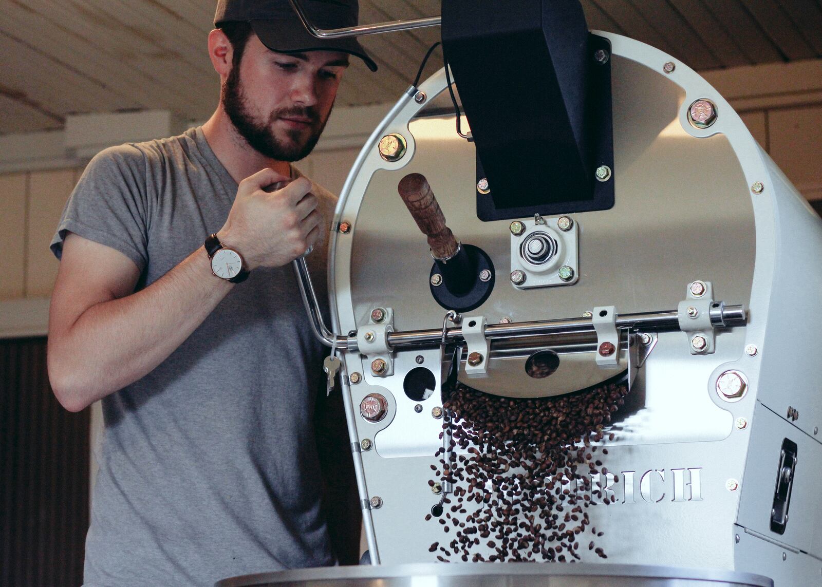 Jonathan Purcey works the roaster at Pettibone Coffee, a roastery in the Dayton area. Purcey and his mother, Marci Purcey, are planning to open a coffee shop in Riverside in February. CONTRIBUTED