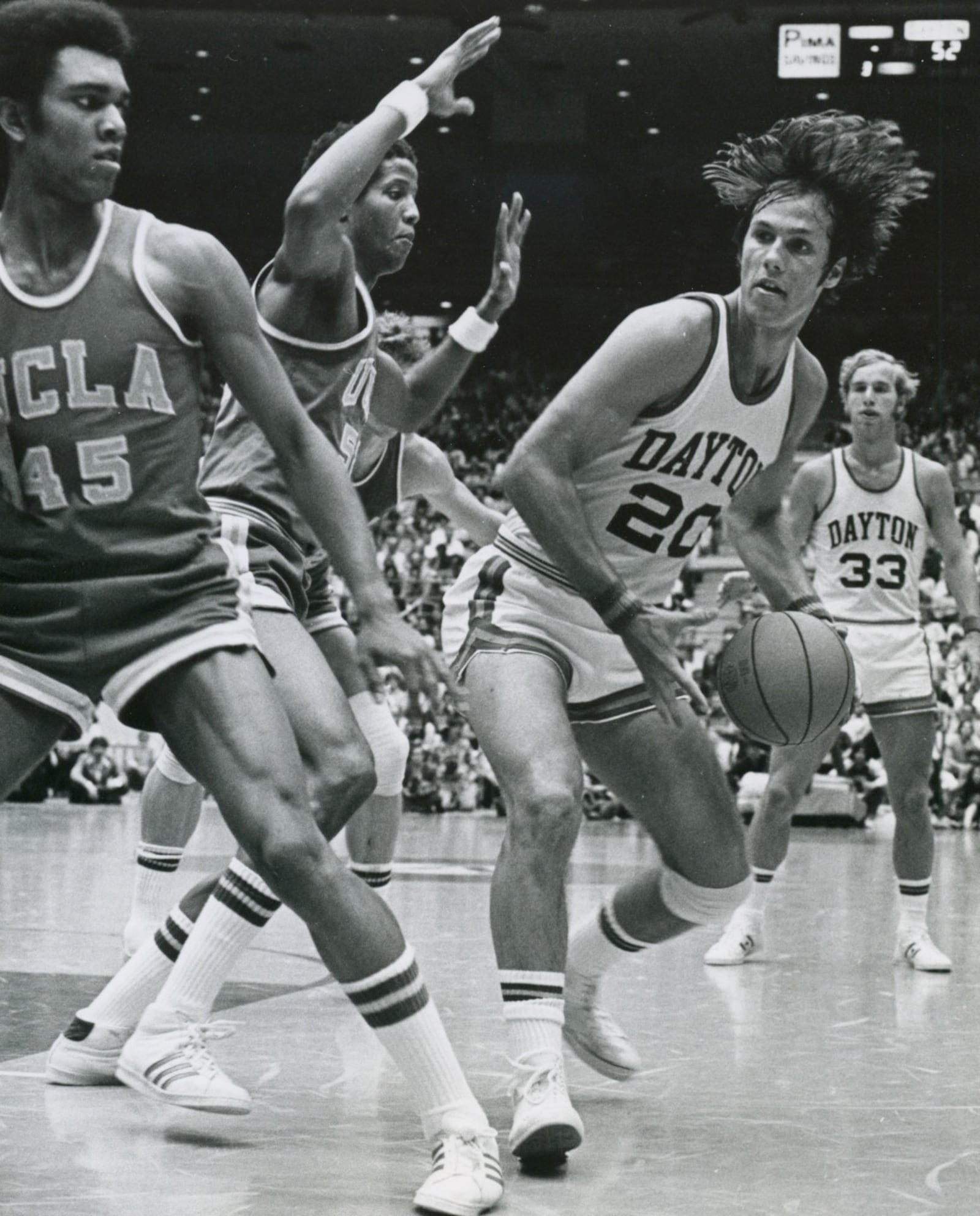 Former University of Dayton basketball standout Mike Sylvester (right) won a silver medal with Italy in the 1980 Olympics in Moscow. Sylvester was the lone American medalist. The United States boycotted those Games. FILE PHOTO