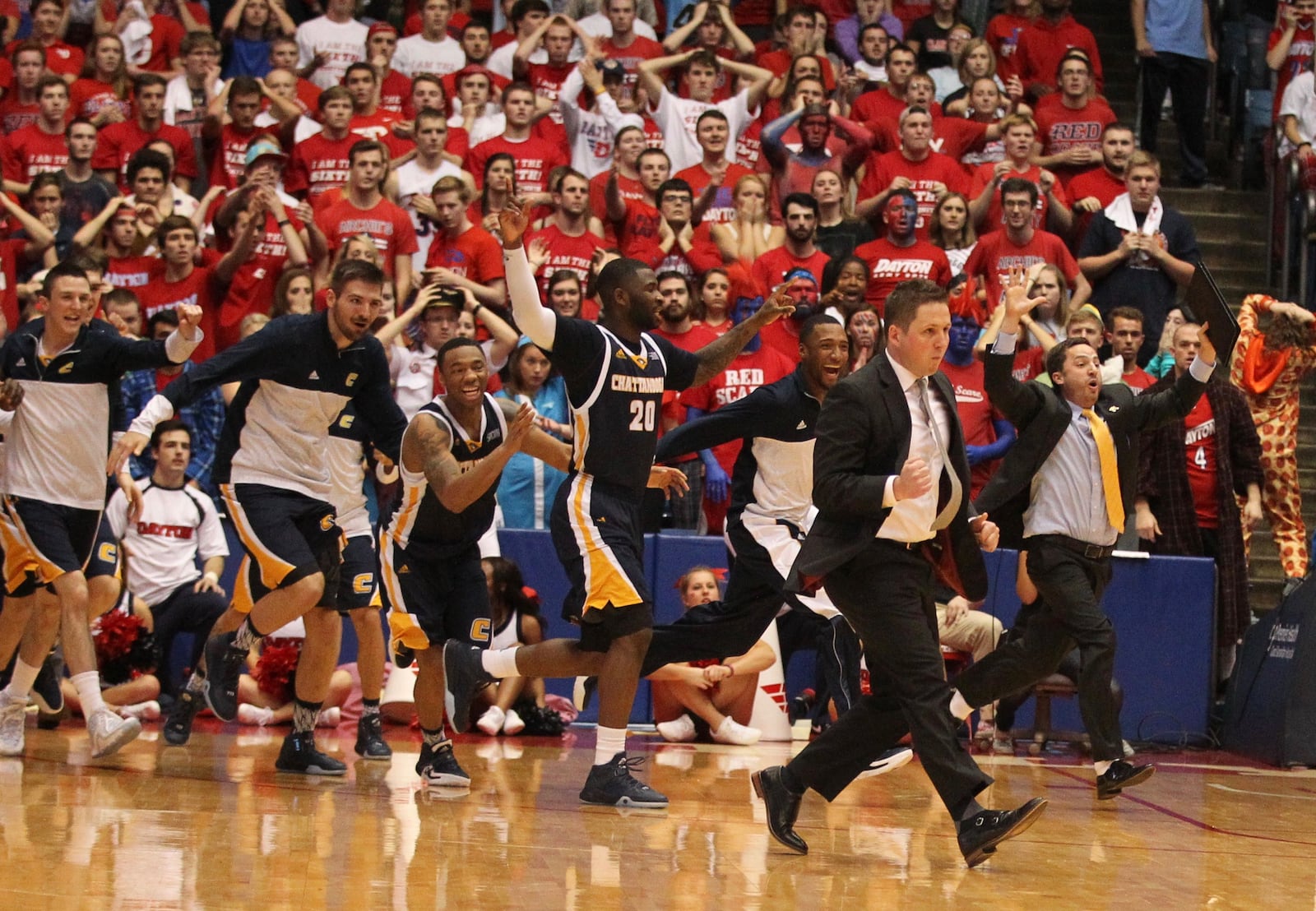 Chattanooga celebrates a victory over Dayton on Saturday, Dec. 12, 2015, at UD Arena in Dayton. David Jablonski/Staff