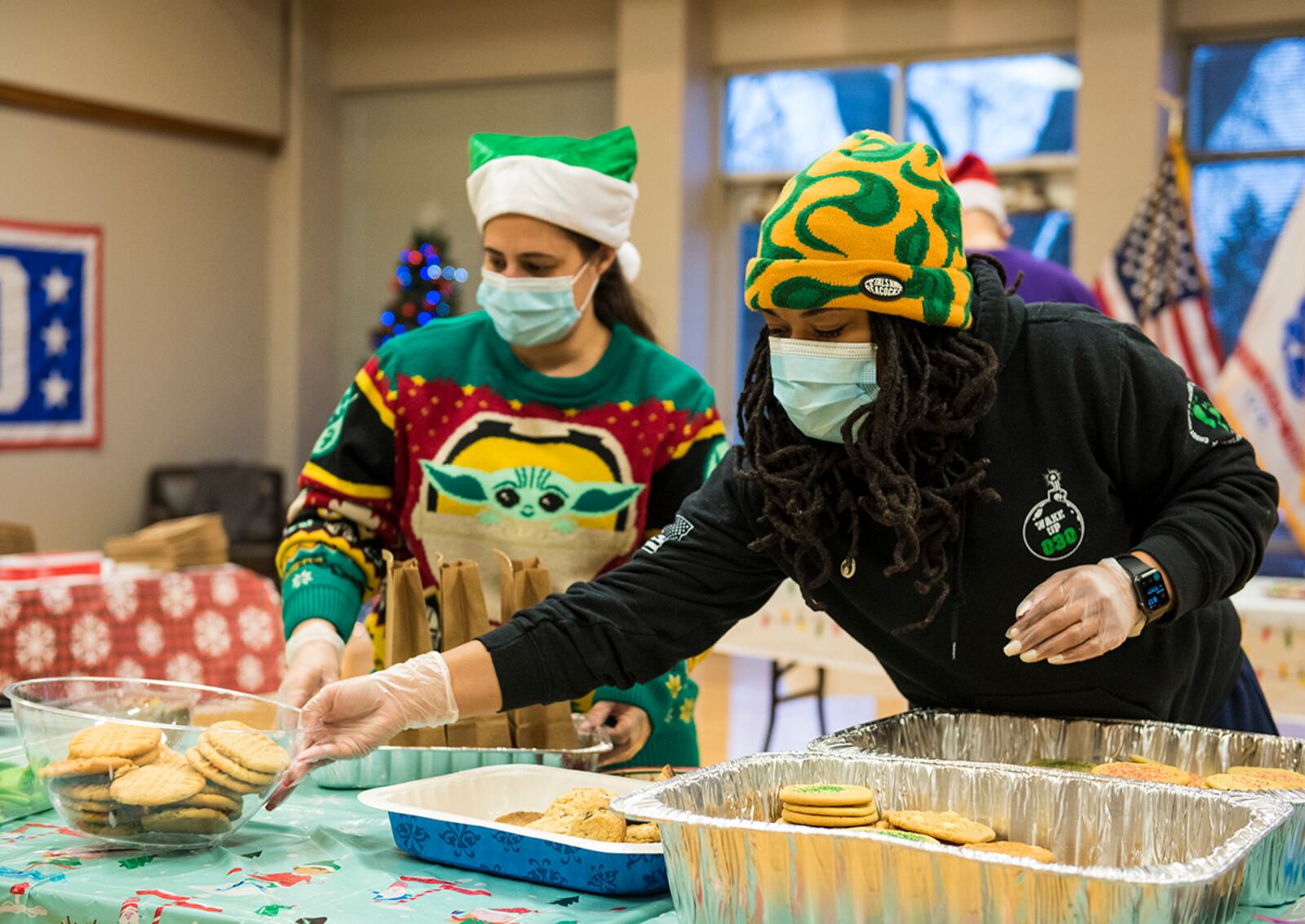 Volunteers fill bags with homemade and store-bought cookies Dec. 8 during the 21st annual Airmen Cookie Drive at Wright-Patterson Air Force Base. In all, more than 16,600 cookies were donated, and 1,386 individual bags are set for delivery to unaccompanied Airmen. U.S. AIR FORCE PHOTO/JAIMA FOGG