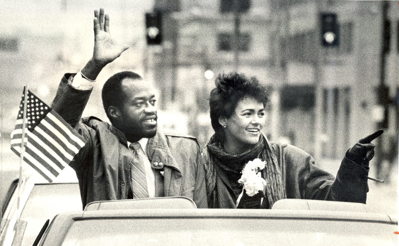 A parade for the two-time Olympic champion was held in downtown Dayton in 1984. Edwin C. Moses and his wife Myrella rode from Courthouse Square to Memorial Hall in a convertible with a patriotic banner covering the hood. More than 1,000 Dayton public school children walked alongside holding American flags high as Moses and his wife waved to the crowd on the streets. DAYTON DAILY NEWS ARCHIVE