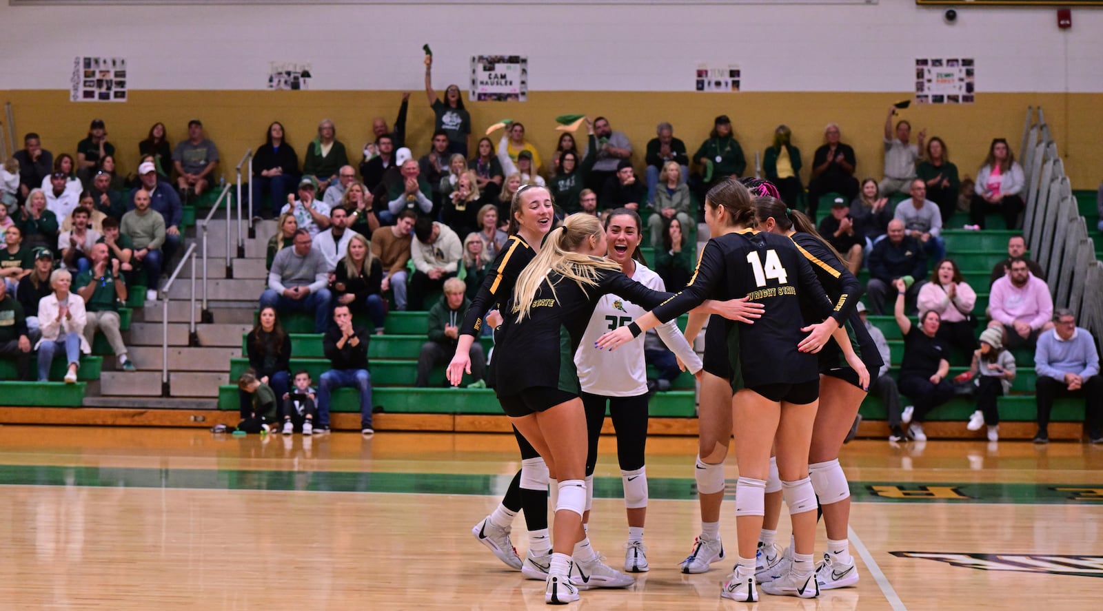 Wright State volleyball players celebrate a winning point earlier this season vs. Purdue Fort Wayne. The Raiders clinched an outright Horizon League regular-season title this weekend. Joe Craven/Wright State Athletics