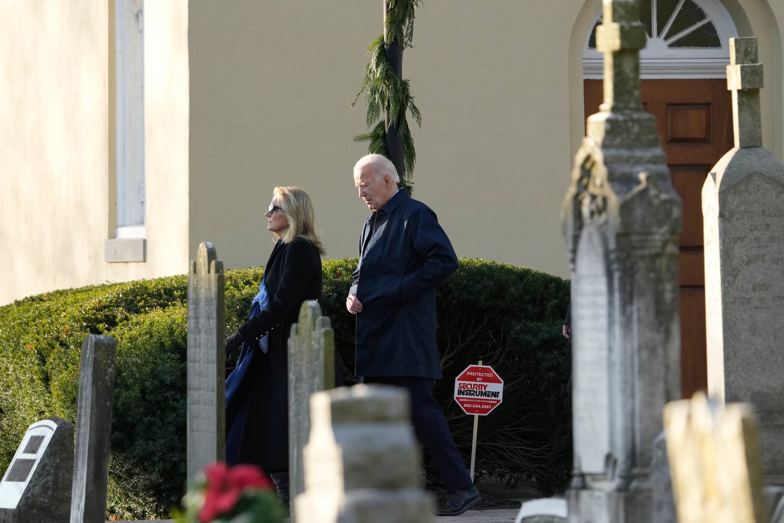 President Joe Biden, first lady Jill Biden walk from Brandywine Catholic Church in Wilmington, Del., on Wednesday, Dec. 18, 2024. Wednesday marks the 52nd anniversary of the car crash that killed Joe Biden's first wife Neilia Hunter Biden and 13-month-old daughter Naomi. (AP Photo/Ben Curtis)