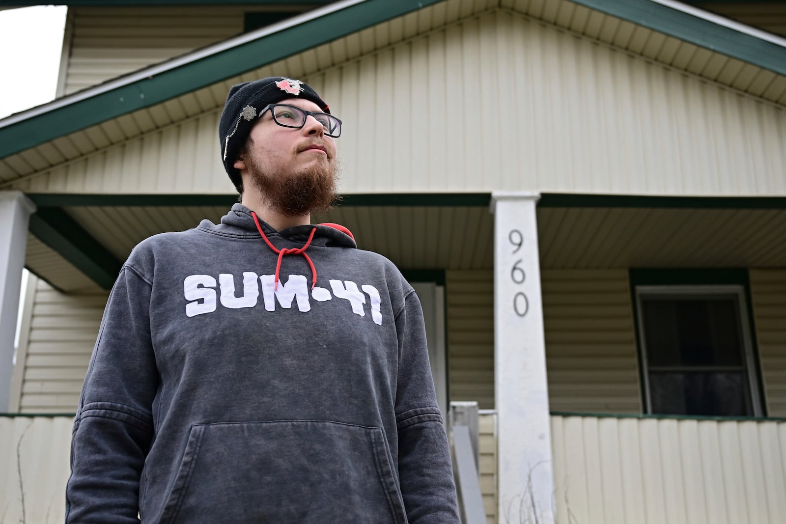 Nicholas Fontaine poses for a portrait outside his home in Akron, Ohio, Tuesday, Dec. 3, 2024. Fontaine is charged with one count of illegal voting. (AP Photo/David Dermer)