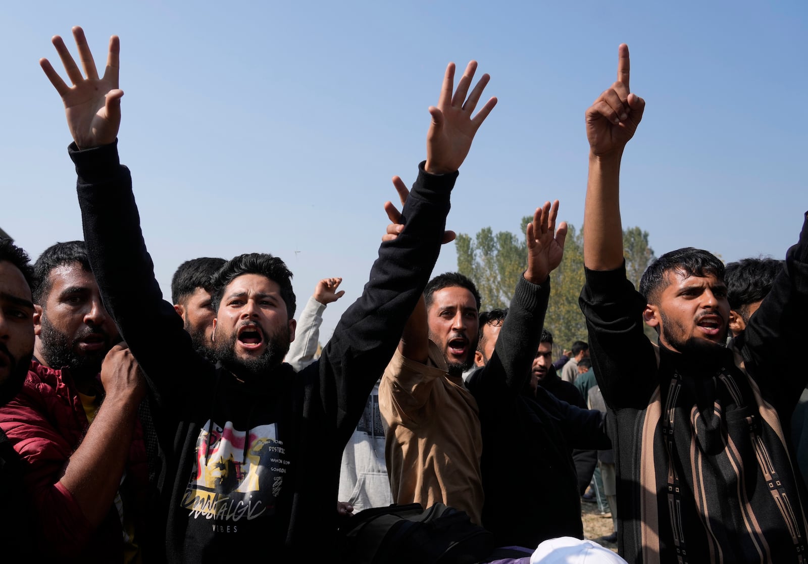 Villagers shout slogans during the funeral of Kashmiri doctor Shahnawaz who was among those killed when gunmen fired at people working on a strategic tunnel project in Indian-controlled Kashmir, at Nadigam village, southwest of Srinagar, Monday, Oct. 21, 2024. (AP Photo/Mukhtar Khan)