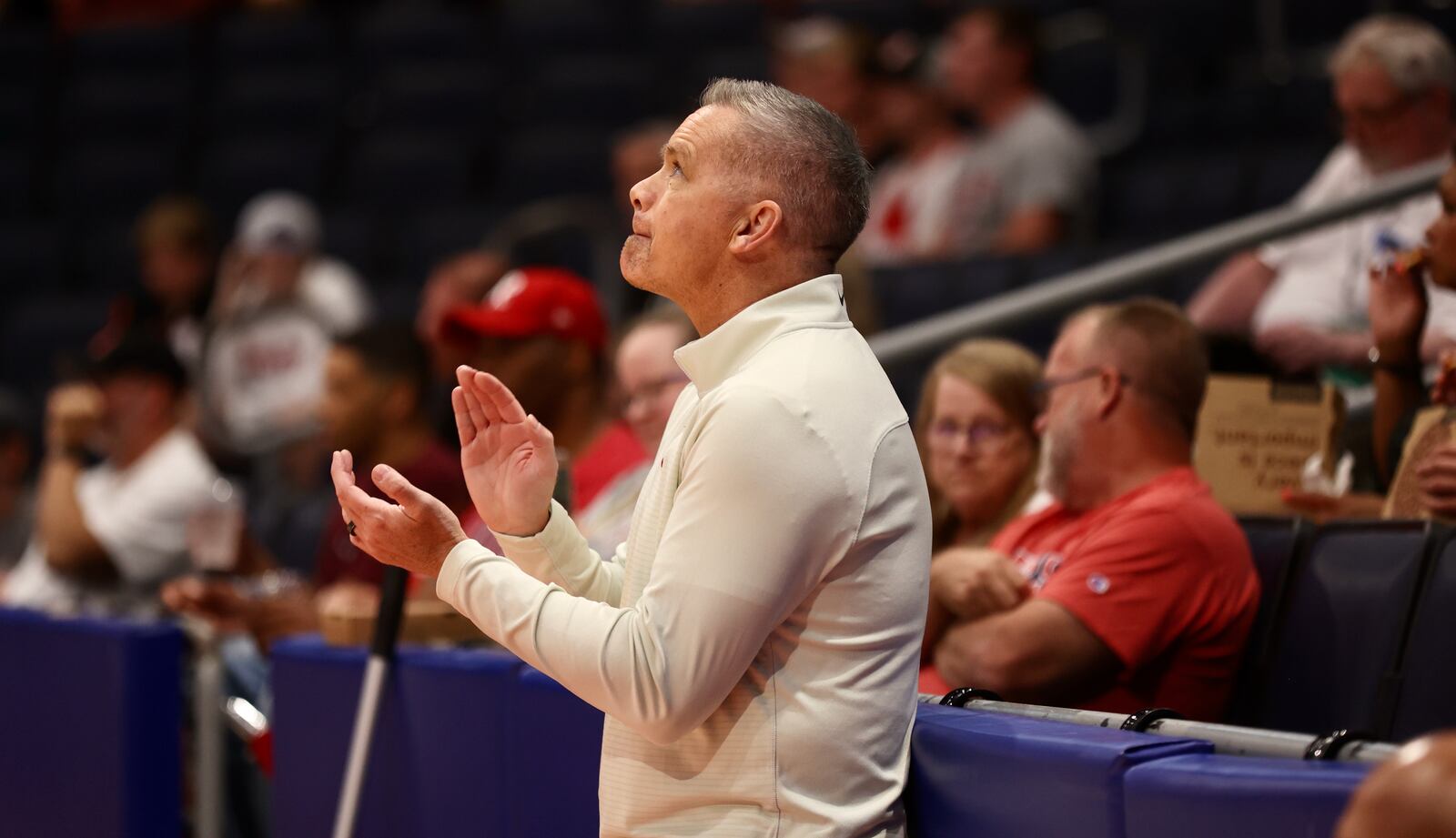 Ohio State coach Chris Holtmann watches Carmen's Crew in the first round of The Basketball Tournament on Wednesday, July 26, 2023, at UD Arena in Dayton. David Jablonski/Staff