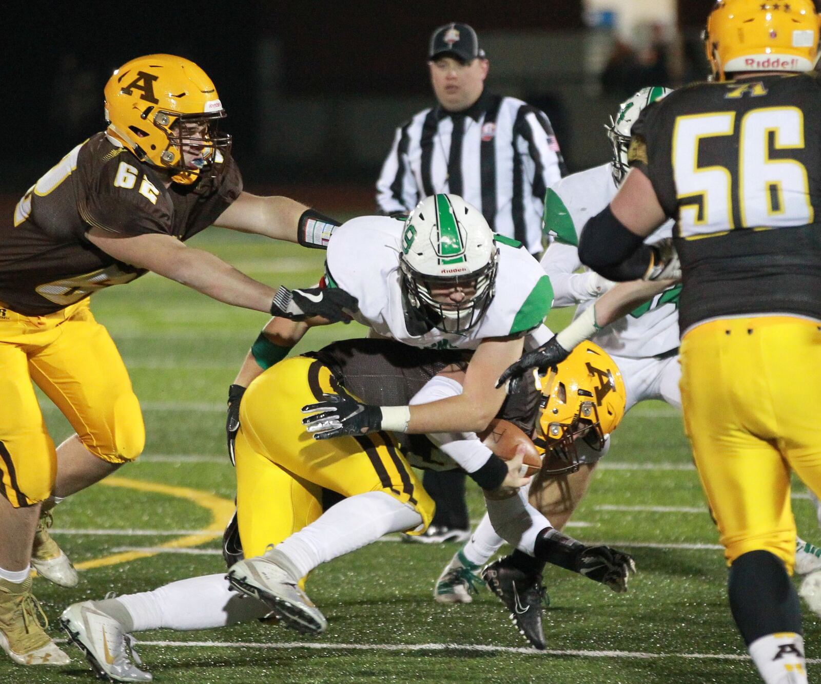 Dane Lauer of Badin (top) takes down Alter QB Kale Steneman. Badin defeated Alter 38-21 in a D-III, Region 12 high school football semifinal at Monroe on Friday, Nov. 15, 2019. MARC PENDLETON / STAFF