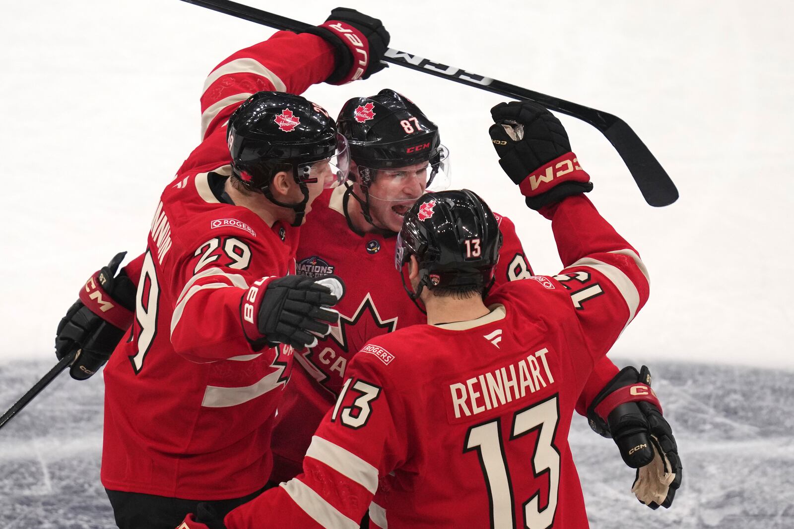 Canada's Sidney Crosby, center, celebrates after his goal against Finland during the third period of a 4 Nations Face-Off hockey game, Monday, Feb. 17, 2025, in Boston. (AP Photo/Charles Krupa)