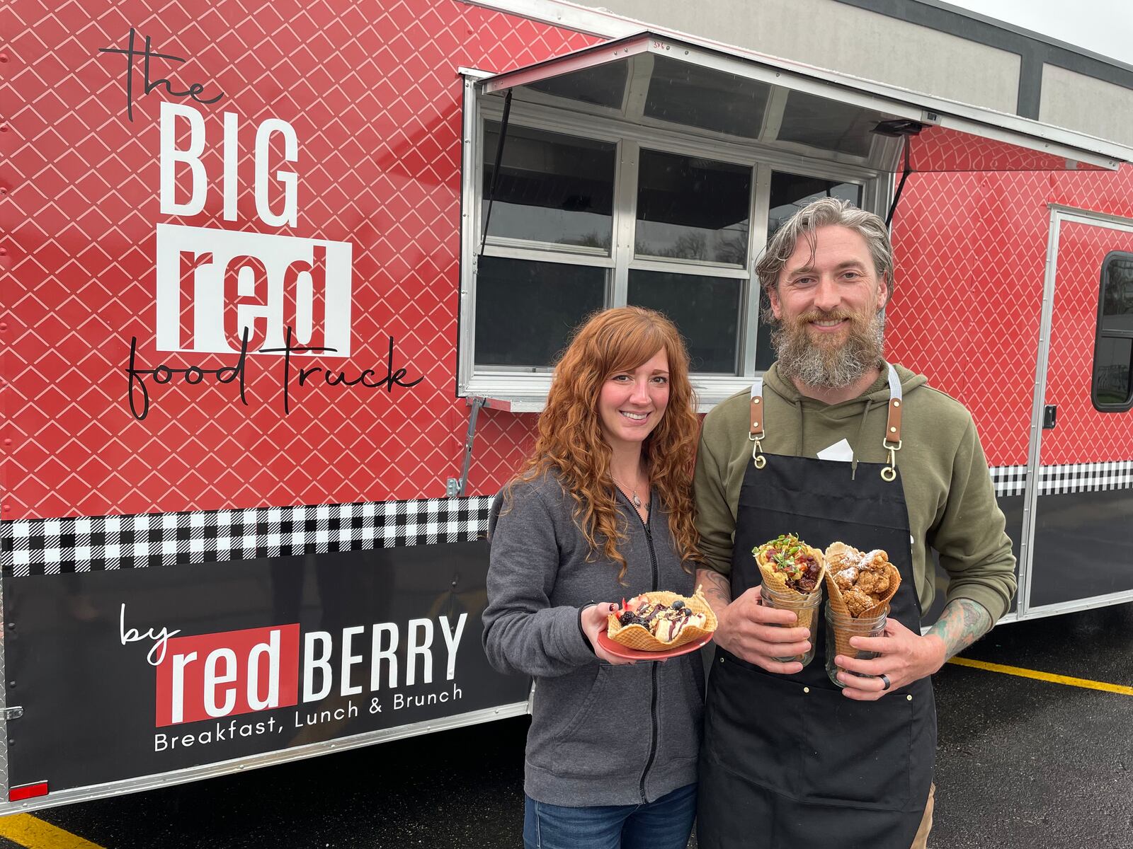 redBERRY in Troy, a restaurant serving breakfast, lunch and brunch, is expanding with a food truck that takes customer favorites and serves it in a made-from-scratch waffle cone. Pictured is Mykie Thompson, director of food truck operations, and her husband, Patrick Thompson, who is the head chef (NATALIE JONES/STAFF).