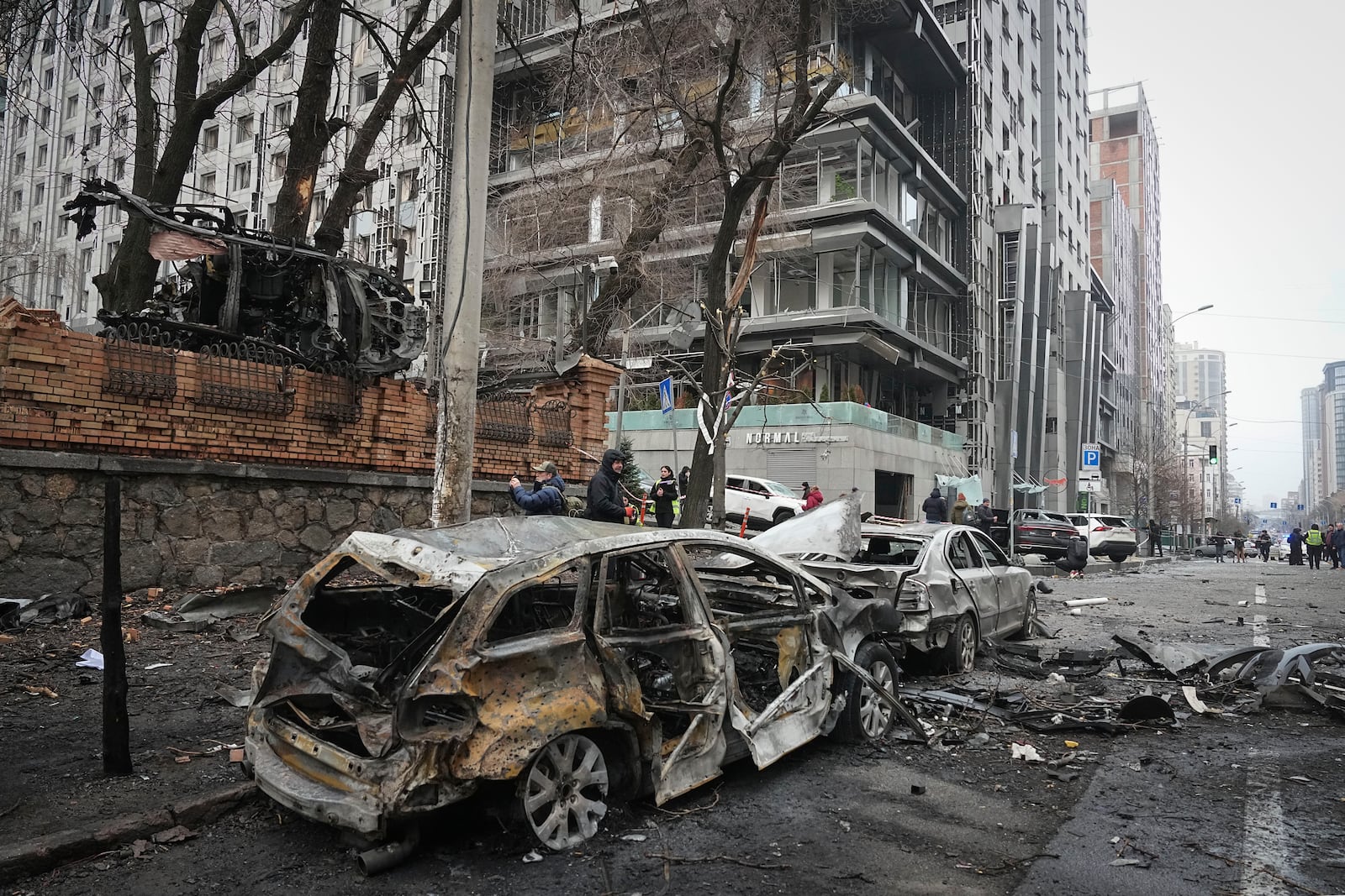 Police officers collect evidence following recent Russian attacks in Kyiv, Ukraine, Friday, Dec. 20, 2024. (AP Photo/Efrem Lukatsky)