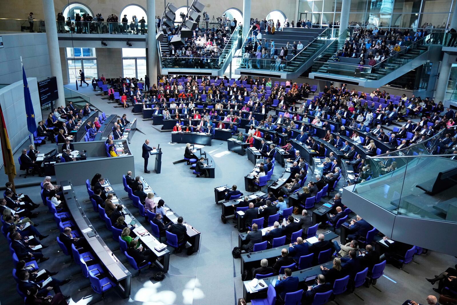 German opposition leader and Christian Democratic Union party chairman Friedrich Merz, right, speaks during a debate and voting about loosen the country's debt rules and change constitution in the German Parliament Bundestag in Berlin, Germany, Tuesday, March 18, 2025. (AP Photo/Ebrahim Noroozi)