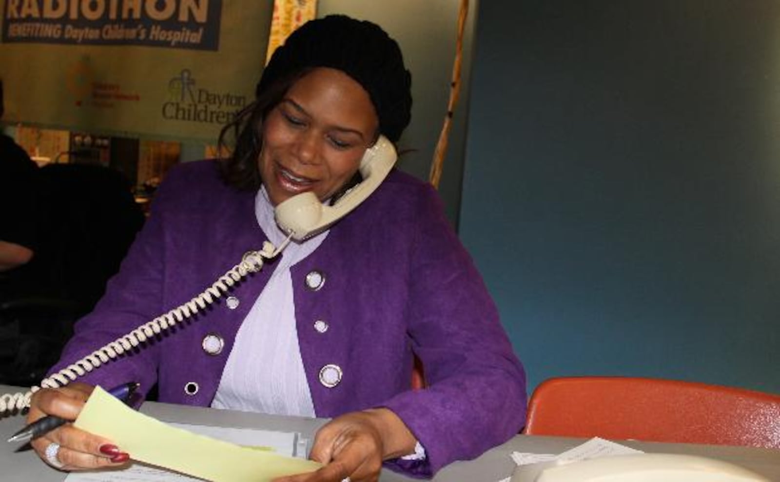 Letitia Perry answers phones during the annual Cares for Kids Radiothon Wednesday, Nov. 19 at Dayton Children's Hospital.  Bob Garlock / Staff