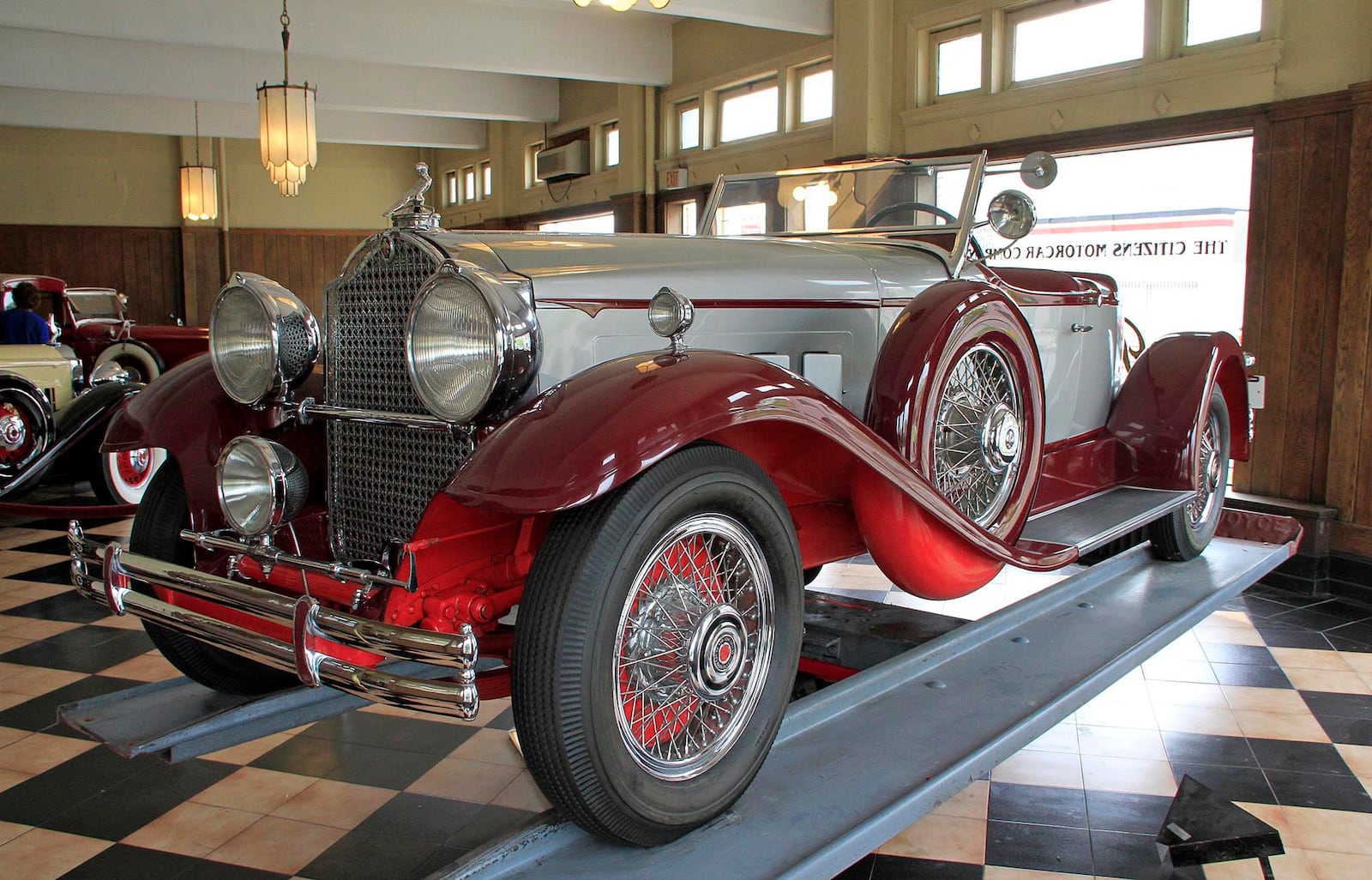 A  1930 Packard Model 734 Boat Tail Speedster sits in the showroom of America's Packard Museum.  Offered in five different body styles, only 39 Boat Tail cars were built and it is believed that only 11 survive.  Capable of speeds over 100 mph, the 4,250 lb. car cost $5,200.
©  Photograph by Skip Peterson
