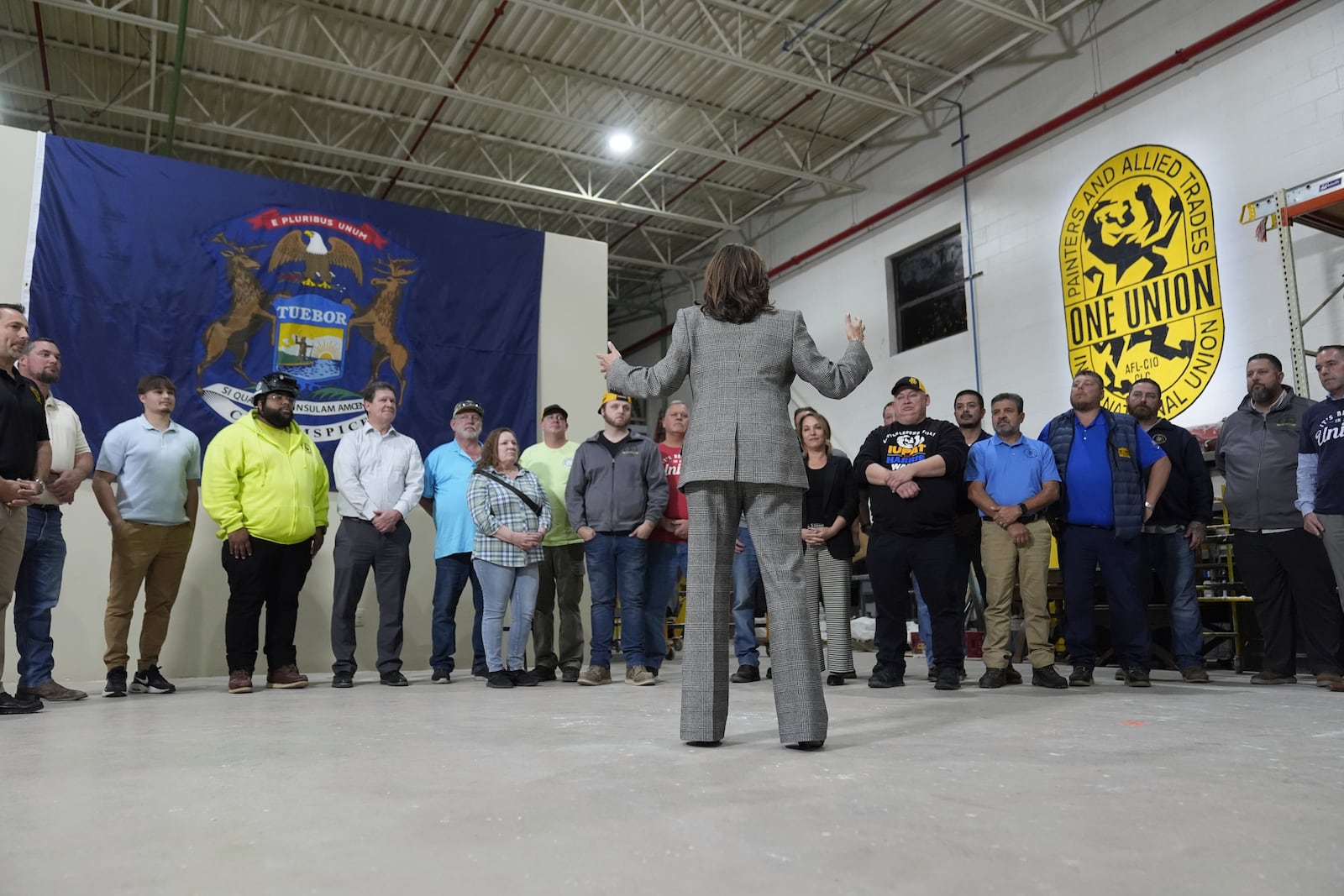 Democratic presidential nominee Vice President Kamala Harris tours the International Union of Painters and Allied Trades District Council 1M facilities, Monday, Oct. 28, 2024, in Warren, Mich. (AP Photo/Paul Sancya)