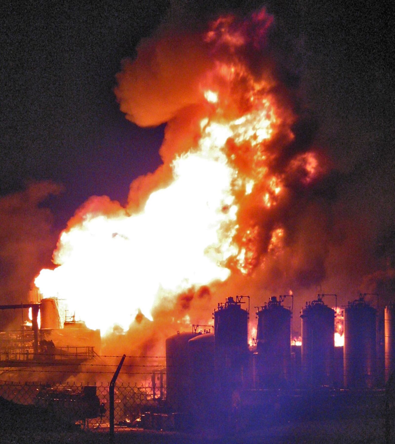 A nighttime photo of the flames that erupted after an explosion at the Veolia Environmental Services plant at 4301 Infirmary Road in West Carrollton on May 4, 2009. The explosion rocked the neighborhood and sent flames and smoke into the air that could be seen for miles.