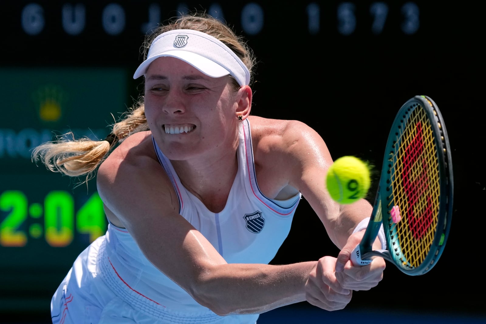 Ekaterina Alexandrova of Russia plays a backhand return to Emma Raducanu of Britain during their first round match at the Australian Open tennis championship in Melbourne, Australia, Tuesday, Jan. 14, 2025. (AP Photo/Manish Swarup)