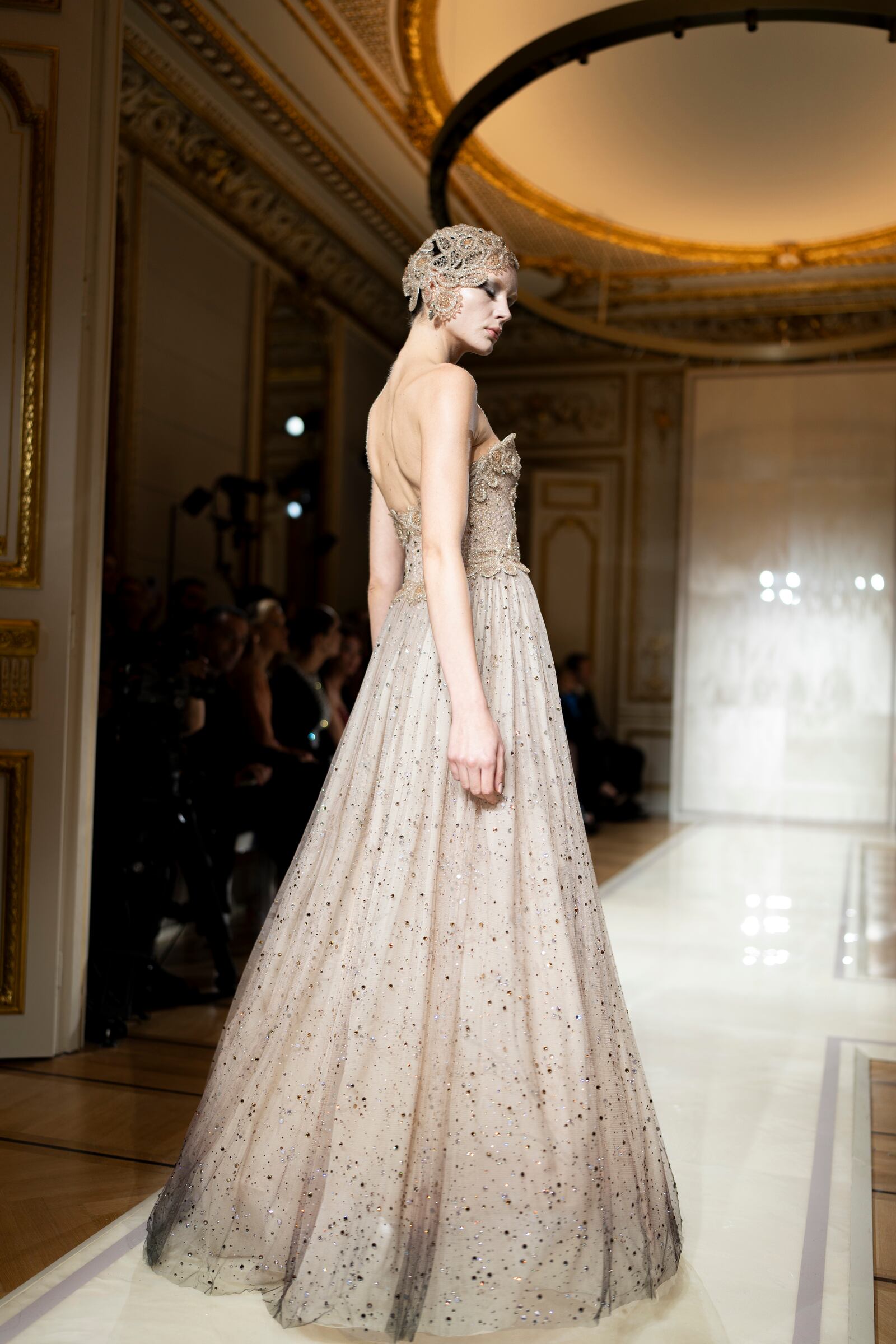 A model wears a creation as part of the Giorgio Armani Prive Haute Couture Spring Summer 2025 collection, that was presented in Paris, Tuesday, Jan. 28, 2025. (AP Photo/Lewis Joly).