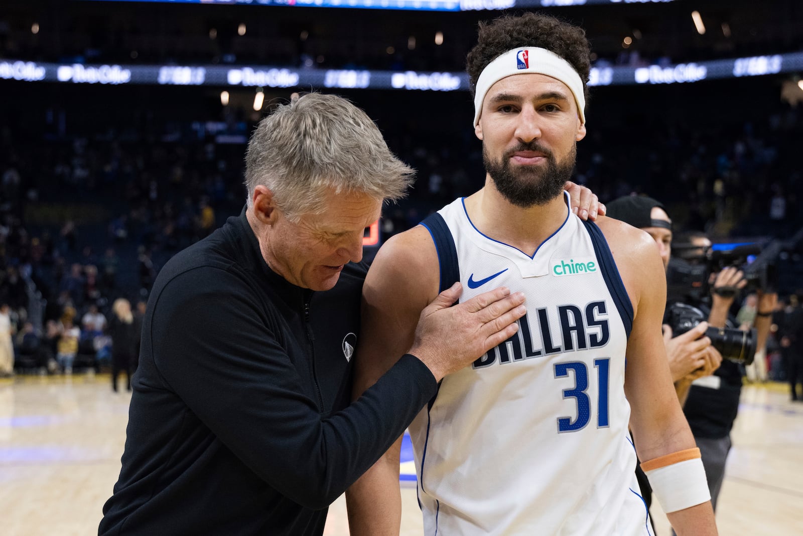 Golden State Warriors head coach Steve Kerr interacts with Dallas Mavericks guard Klay Thompson (31) after an NBA basketball game Sunday, Dec. 15, 2024, in San Francisco. (AP Photo/Benjamin Fanjoy)