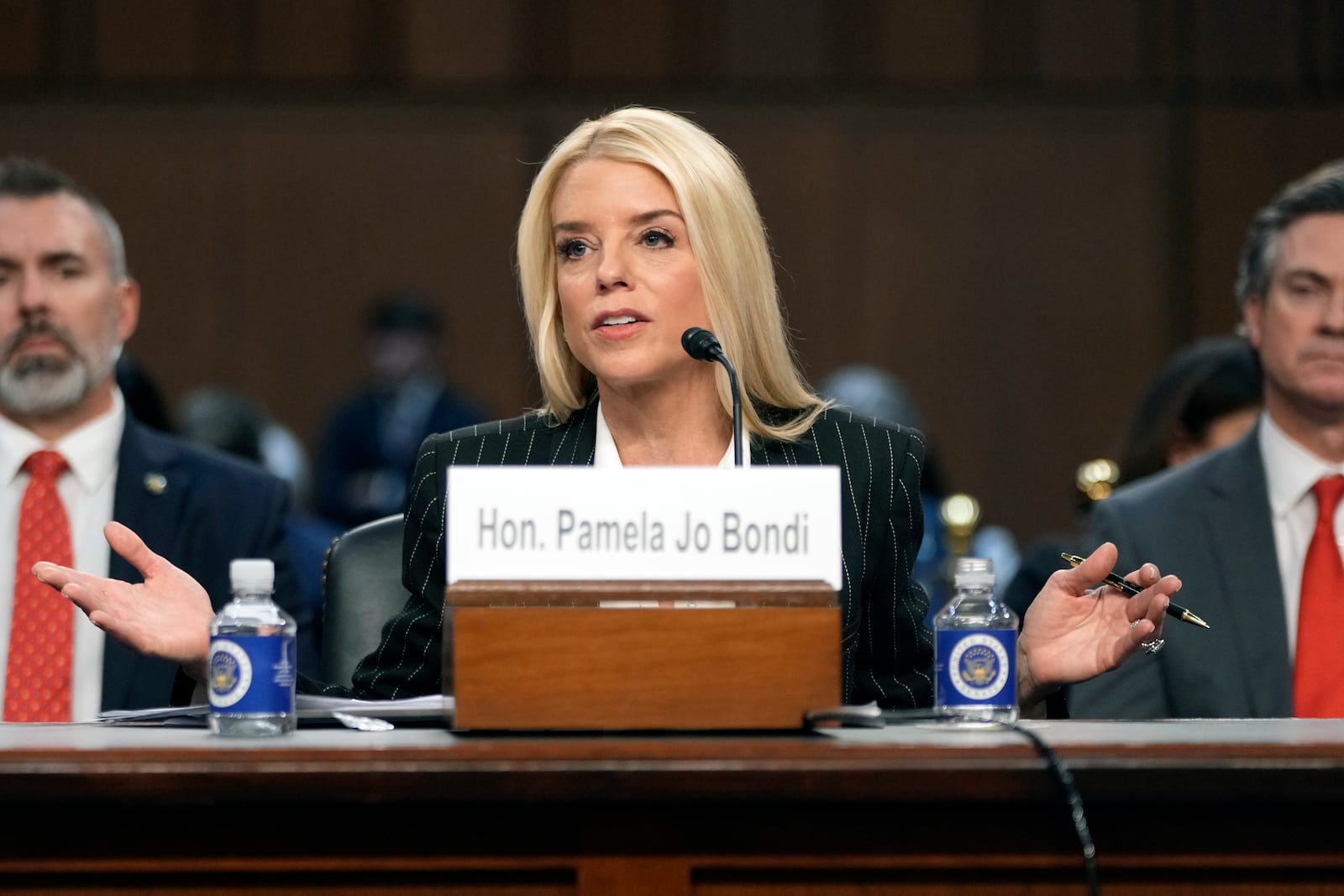 Pam Bondi, President-elect Donald Trump's choice to lead the Justice Department as attorney general, appears before the Senate Judiciary Committee for her confirmation hearing, at the Capitol in Washington, Wednesday, Jan. 15, 2025. (AP Photo/Ben Curtis)