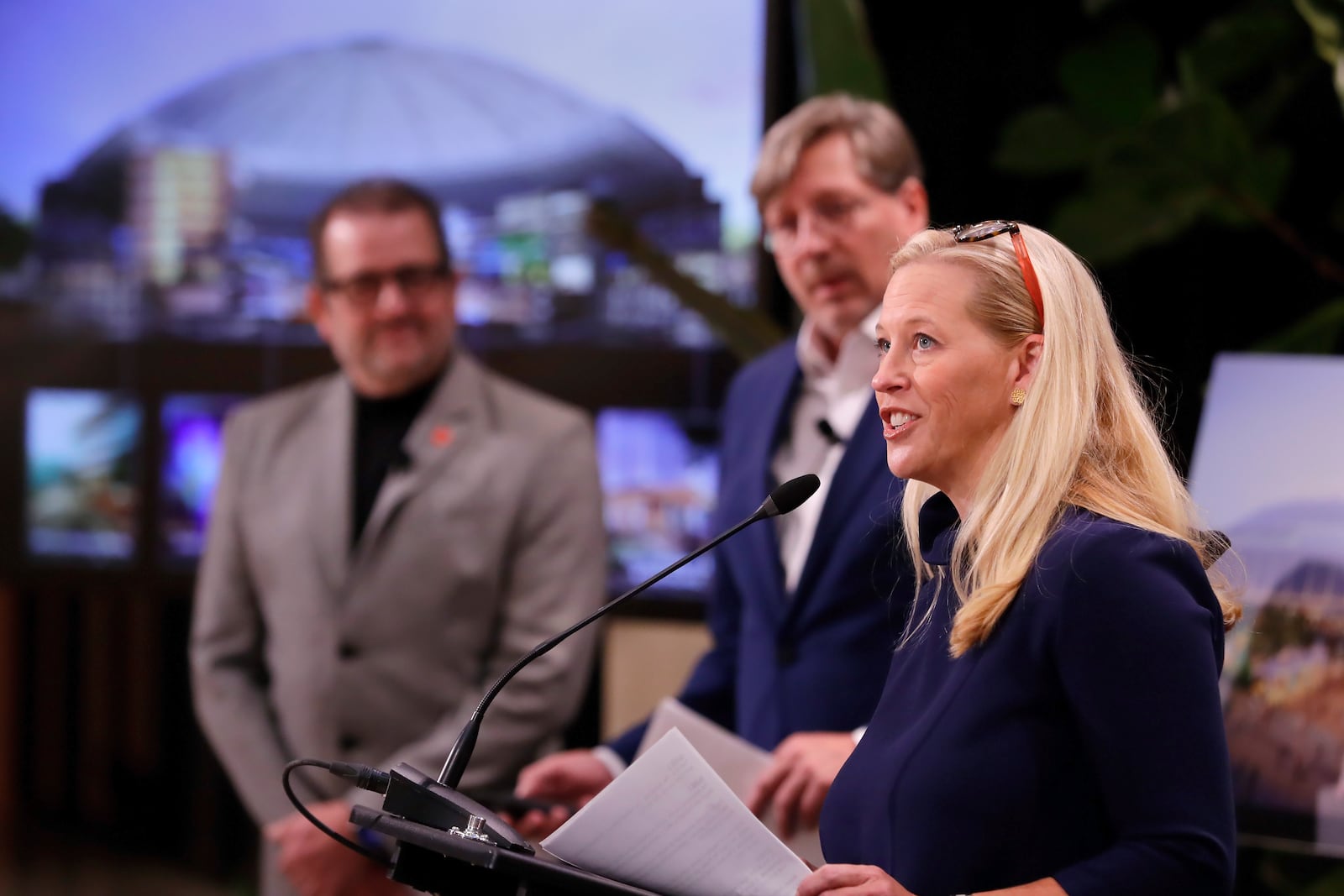 Beth Wiedower Jackson, right, executive director of the Astrodome Conservancy, speaks as Jerry Alexander, left, and Kristopher Stuart, center, both with the Gensler Architects, listen during a press conference put on by the group and held at The Ion ,Wednesday, Nov. 13, 2024, in Houston. The Astrodome Conservancy, a group dedicated to preserving the structure, has proposed a multi-use renovation for the once legendary building. (AP Photo/Michael Wyke)