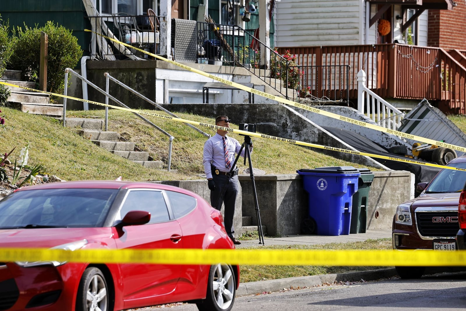 Hamilton police are investigating a death at a home in the 1200 block of Parrish Avenue. Pictured are investigators at the home on Oct. 11, 2022. NICK GRAHAM/STAFF