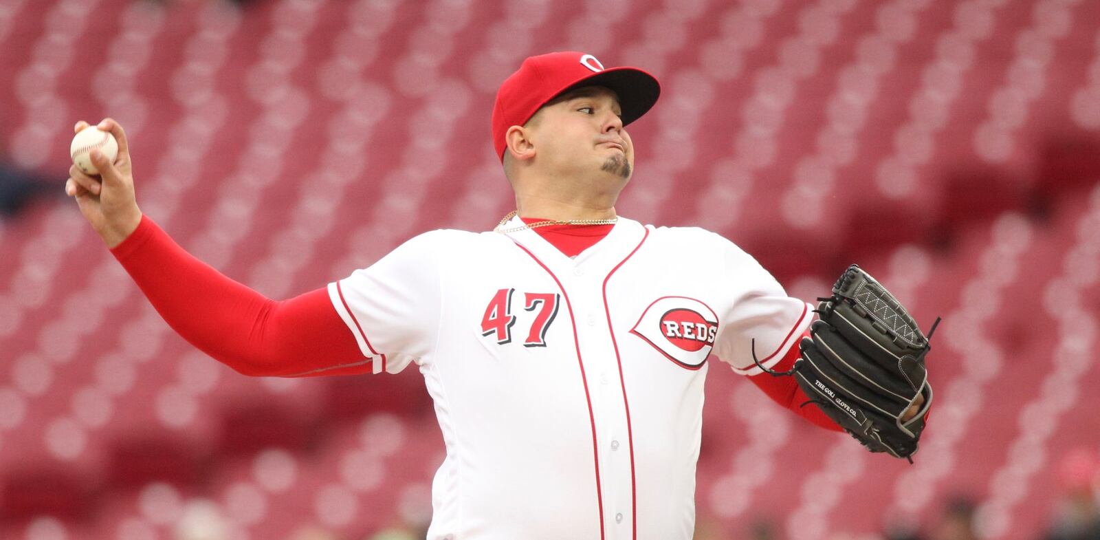 Reds starter Sal Romano pitches against the Braves on Monday, April 23, 2018, at Great American Ball Park in Cincinnati. David Jablonski/Staff