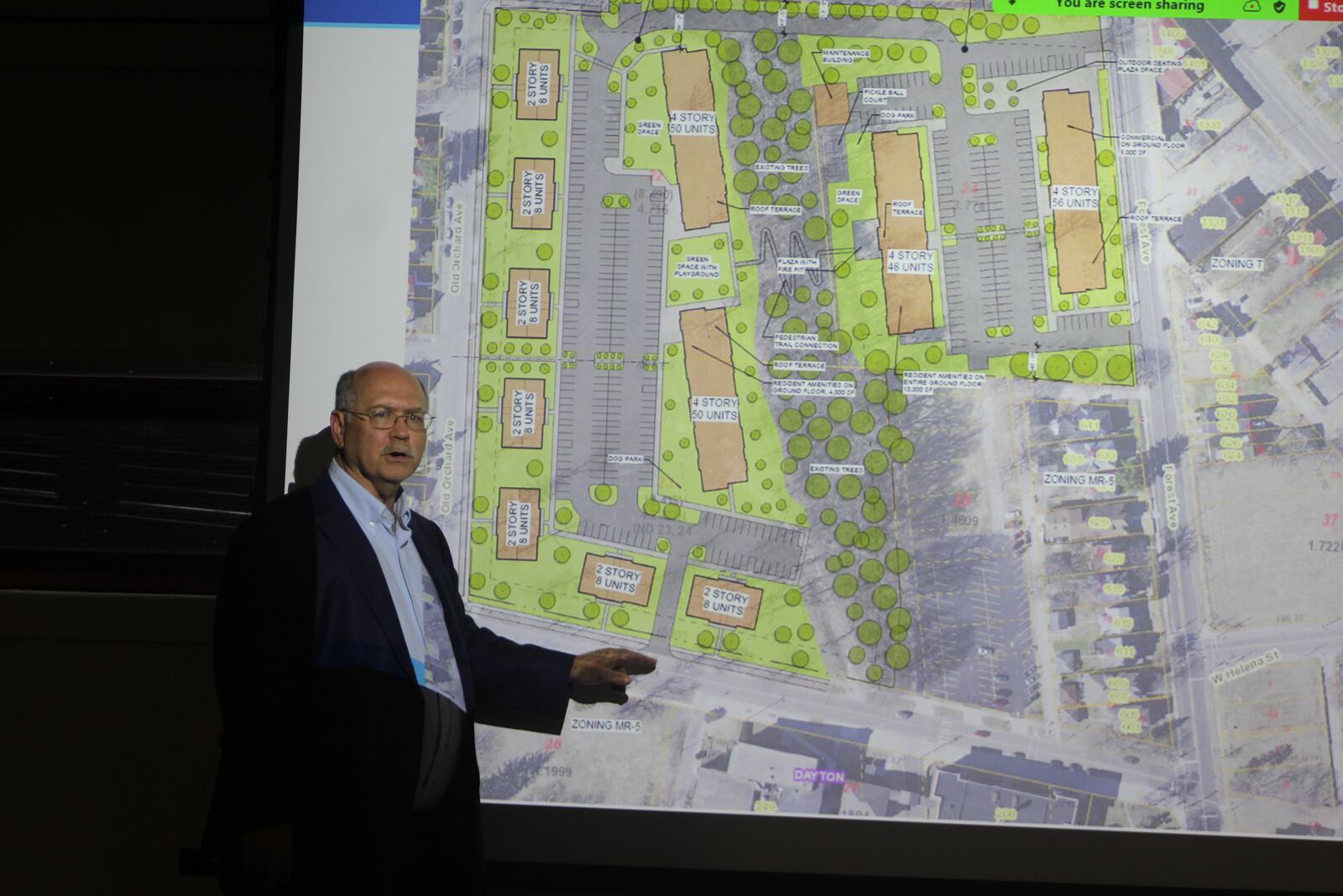 Nathan Jones, who lives in the Five Oaks neighborhood, talks about traffic concerns related to a proposed new housing project. Magnus Capital Partners proposes building 260 new apartment units. CORNELIUS FROLIK / STAFF