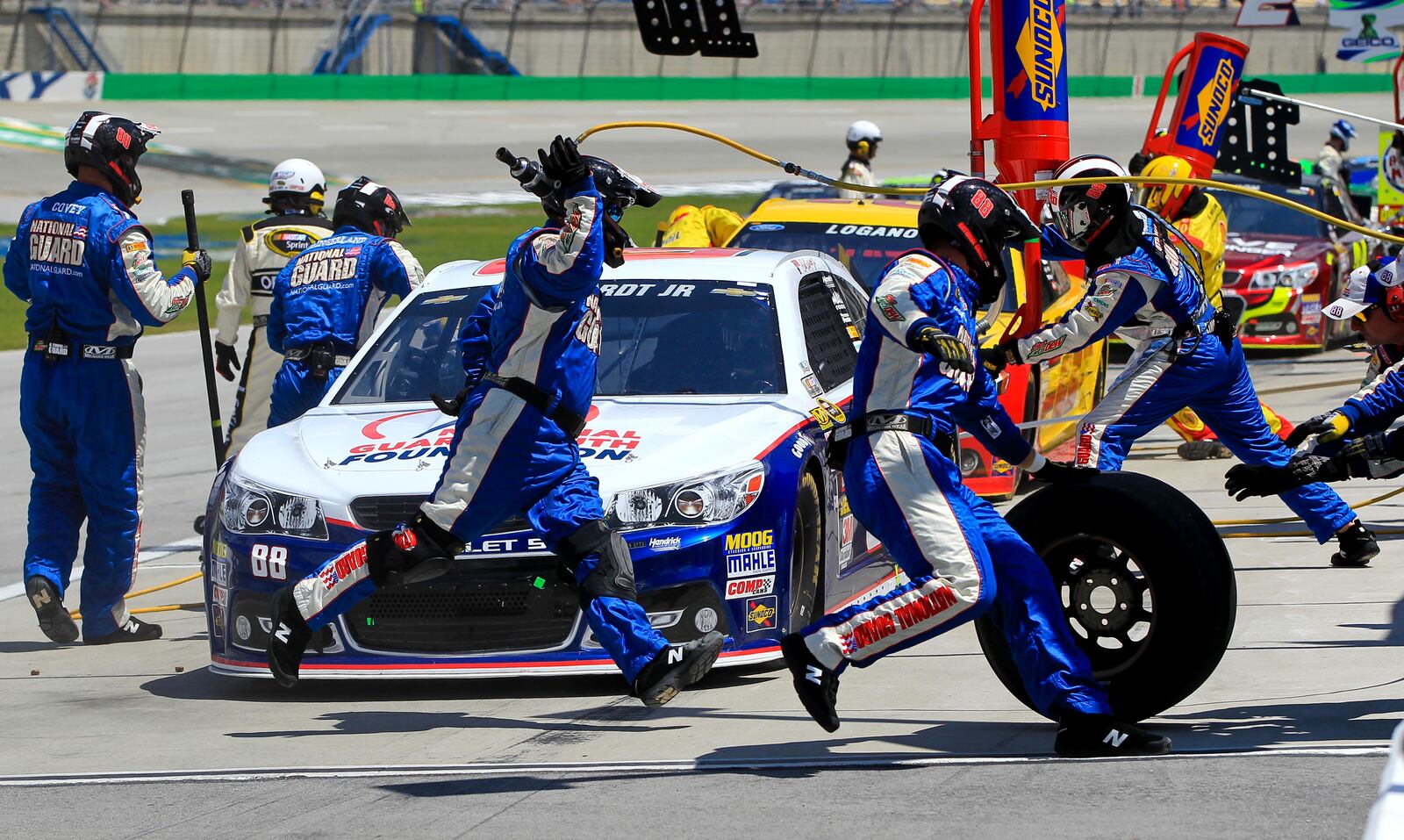 Dale Earnhardt Jr. makes his first pit stop during Sunday’s Quaker State 400 race at Kentucky Speedway Sunday, June 30, 2013. NICK DAGGY / STAFF