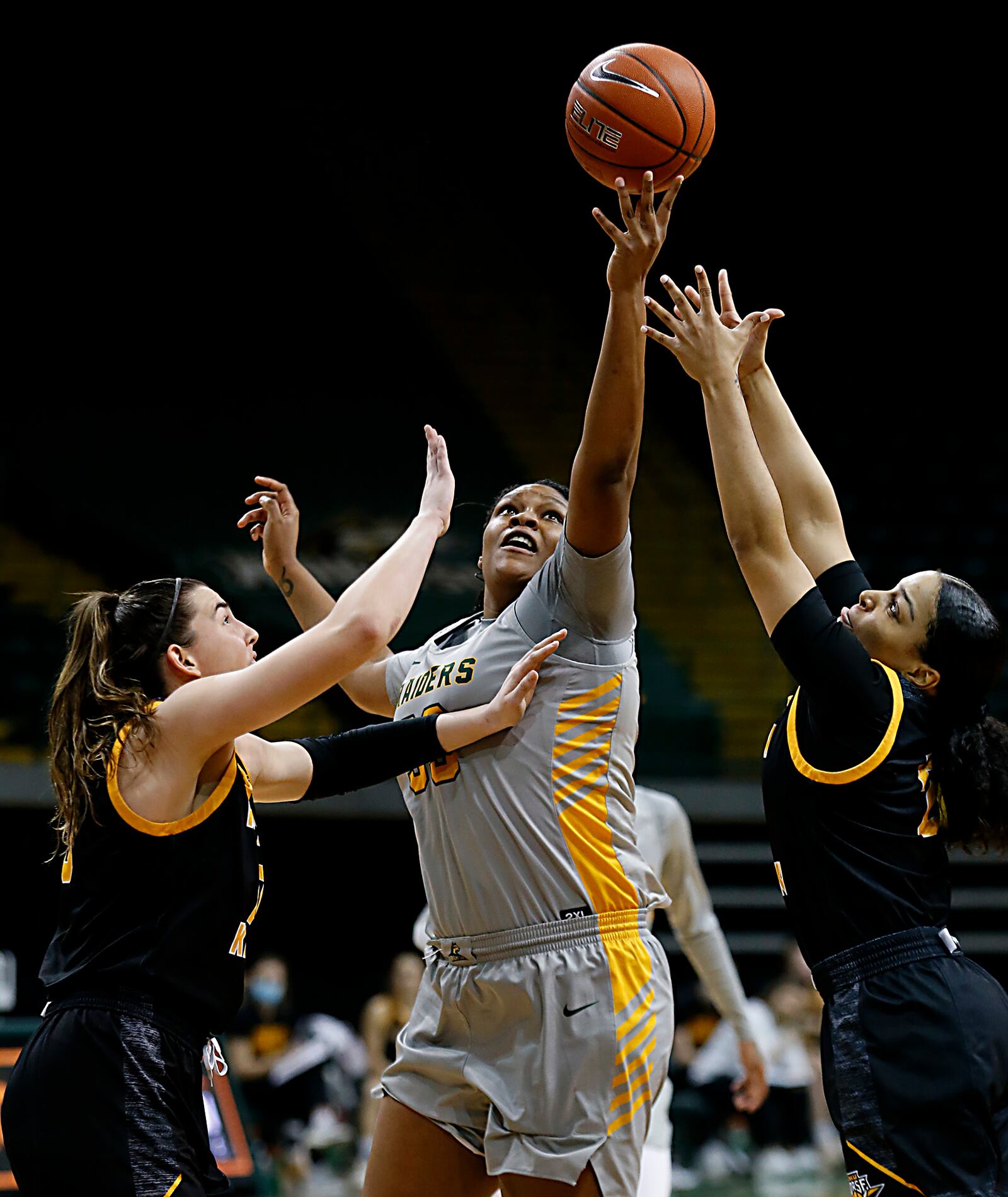 Wright State center Tyler Frierson grabs a rebound against Northern Kentucky forward/center Grayson Rose (10) and guard Ivy Turner (2) during a Horizon League quarterfinal at the Nutter Center in Fairborn Mar. 2, 2021. Wright State won 74-56. E.L. Hubbard/CONTRIBUTED