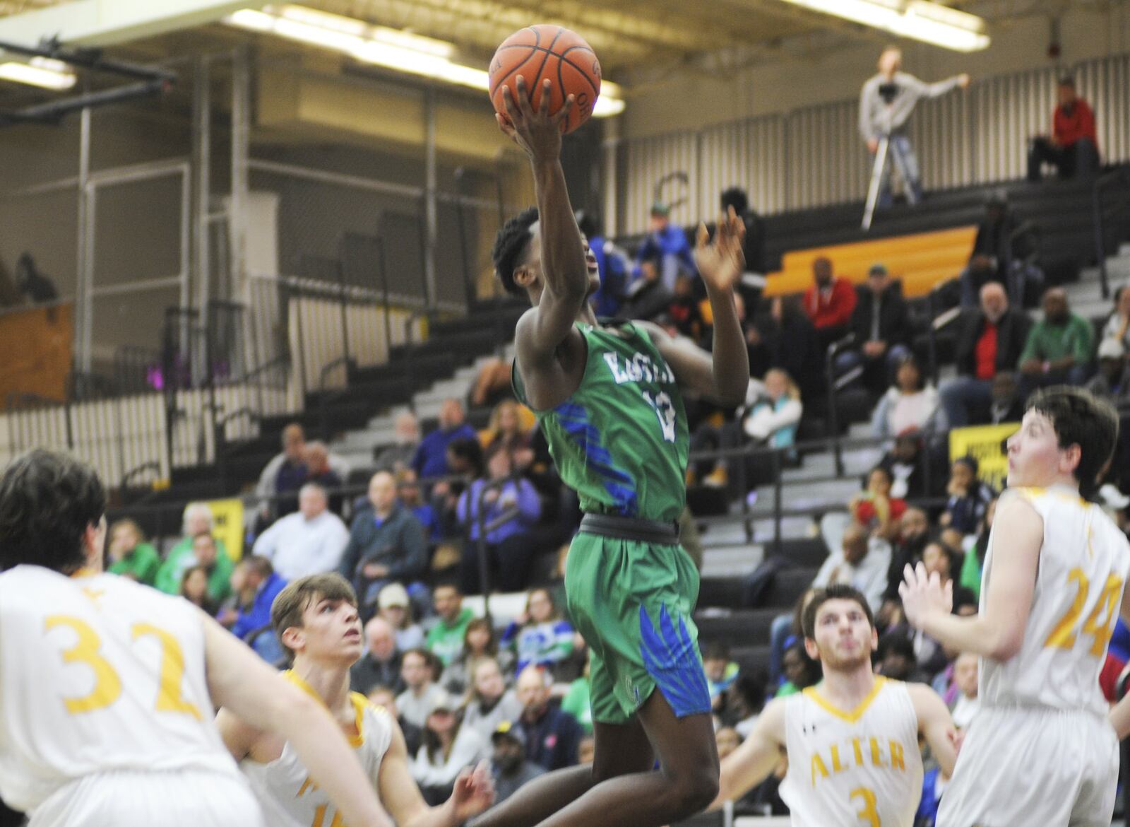 Brandon Gibson of CJ drives for a shot. Chaminade Julienne defeat Alter 63-58 in a boys high school basketball game at Centerville on Sunday, Dec. 16, 2018. MARC PENDLETON / STAFF