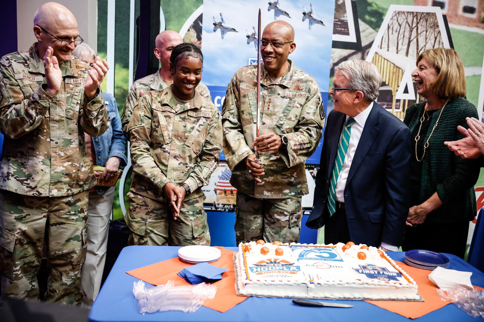 From left, Arnie Bunch, Commander Air Force Materiel Command;  Maquaelin Epperson, Airman Basic; Gen. Charles Q. Brown and Gov. Mike DeWine and his wife Fran DeWine, cut the 75th Anniversary of the Air Force cake at the HOOPLA event held at Carillon Park. Jim Noelker/Staff