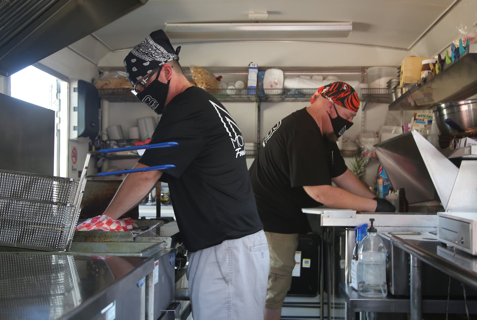 Josh Chavez and Matt Black are the owners of Momma'z Boyz, a Dayton food truck. LISA POWELL / STAFF