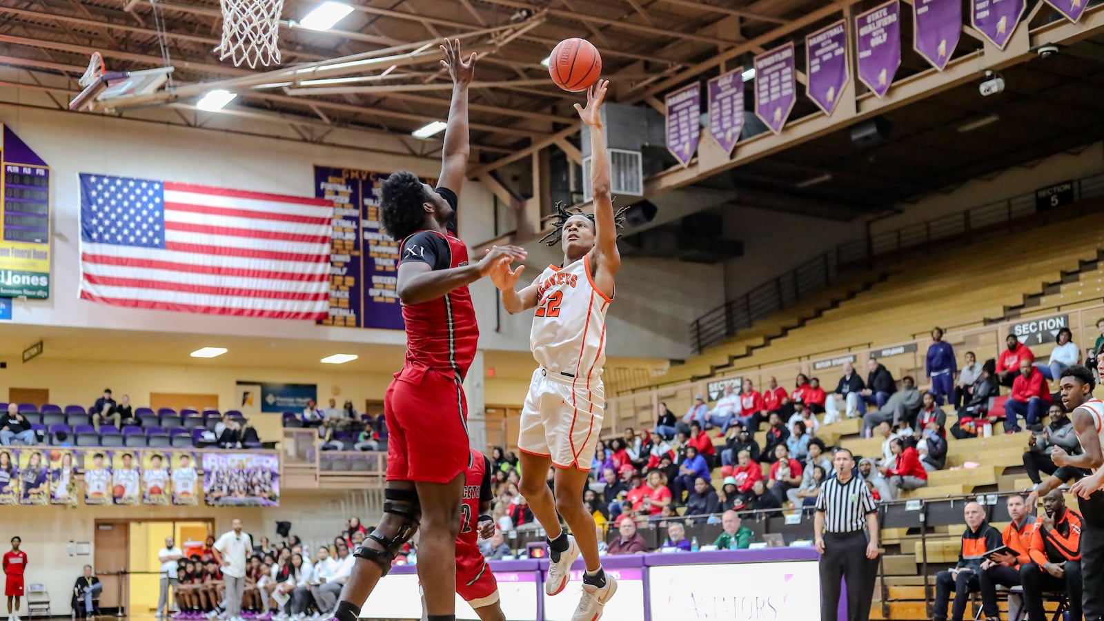 Beavercreek High School senior Isaiah-Michael Williams shoots the ball over Princeton's Kieran Granville-Britten during their game on Saturday afternoon at the Vandalia Butler Student Activities Center. Beavercreek won 49-43. MICHAEL COOPER/STAFF