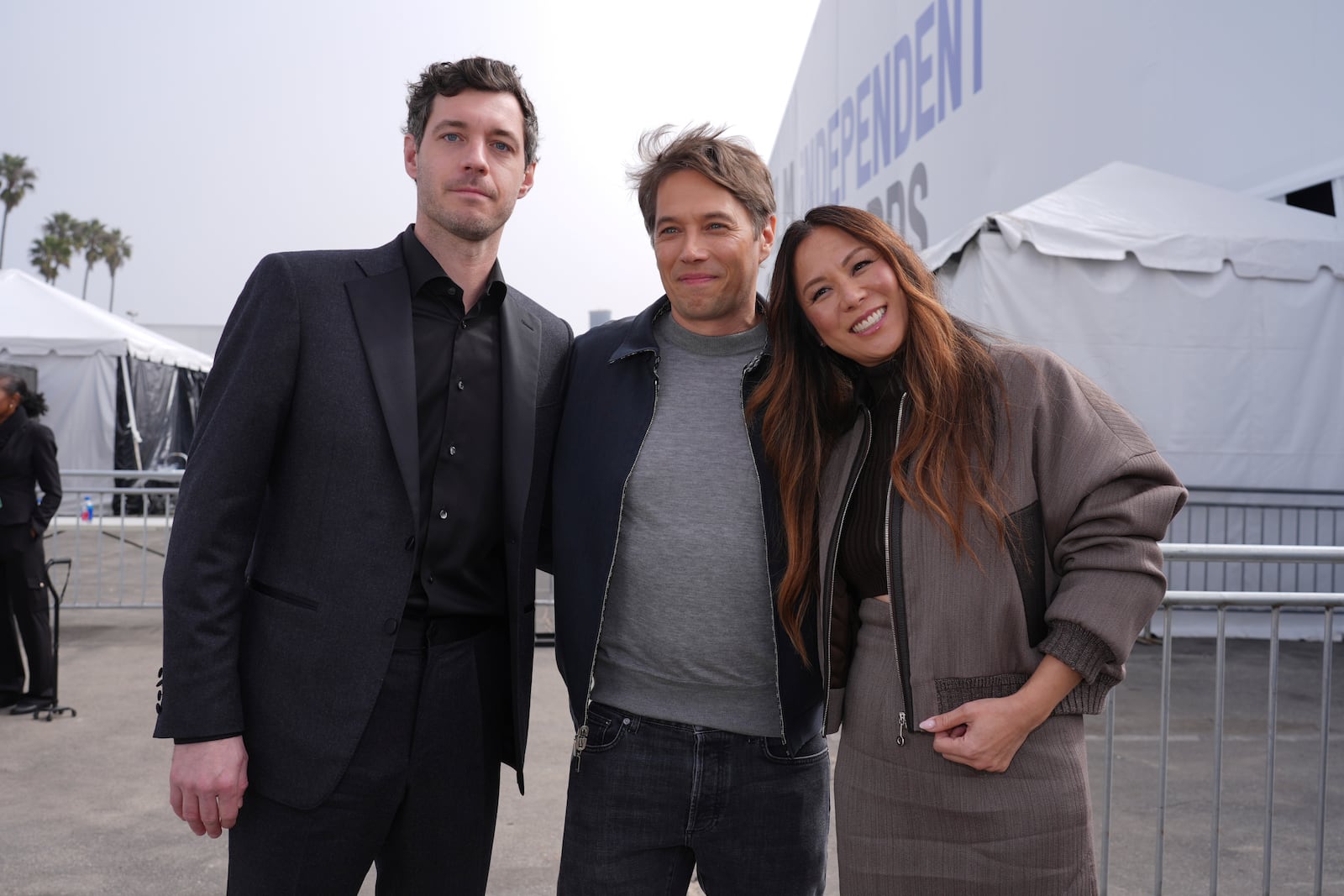 Alex Coco, from left, Sean Baker and Samantha Quan arrive at the Film Independent Spirit Awards on Saturday, Feb. 22, 2025, in Santa Monica, Calif. (AP Photo/Chris Pizzello)