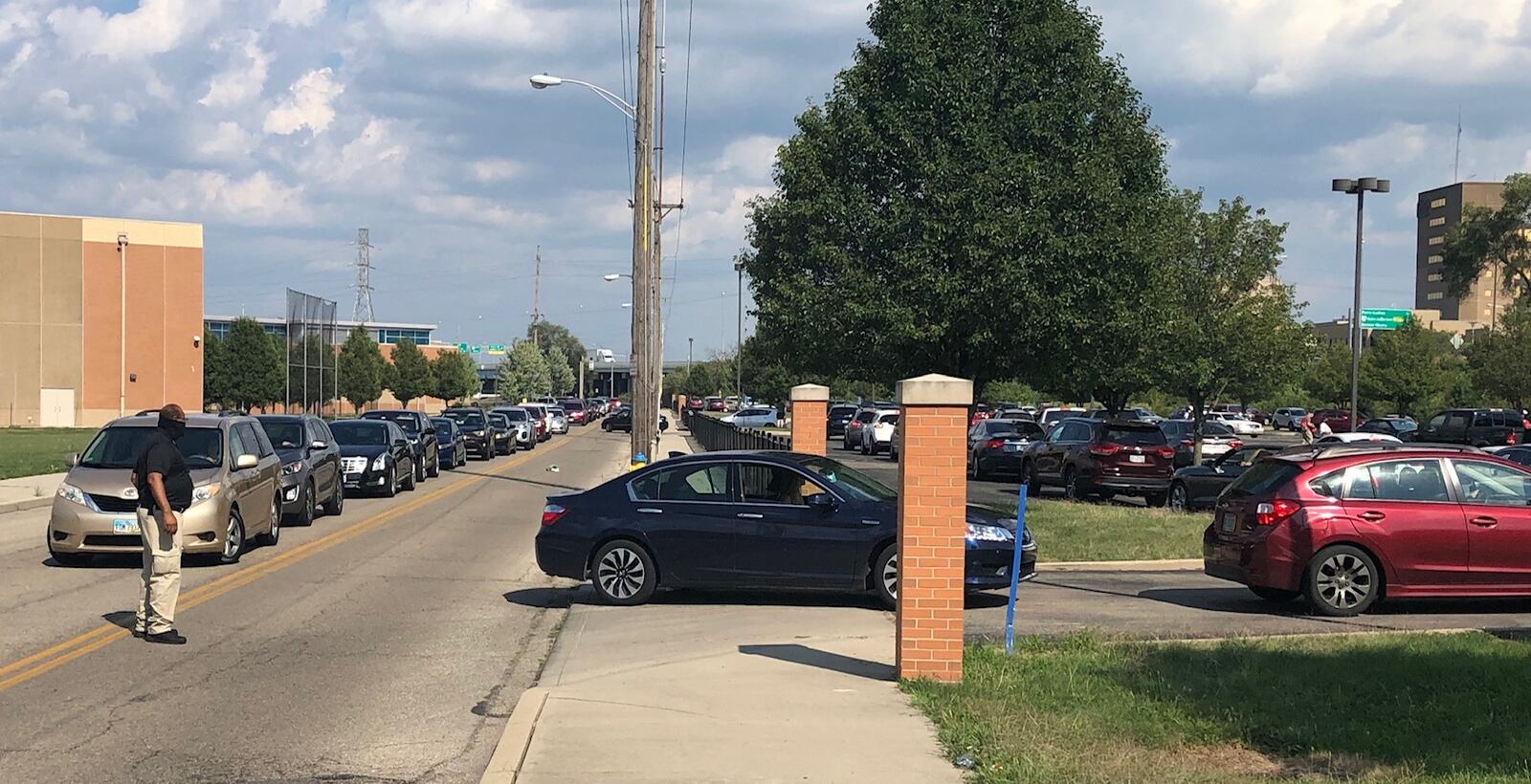 Hundreds of Dayton teachers union members participated in a drive-thru vote  Monday, Aug. 24, 2020, at Ponitz Career Technology Center that is connected to Dayton Public Schools' upcoming layoffs plan.