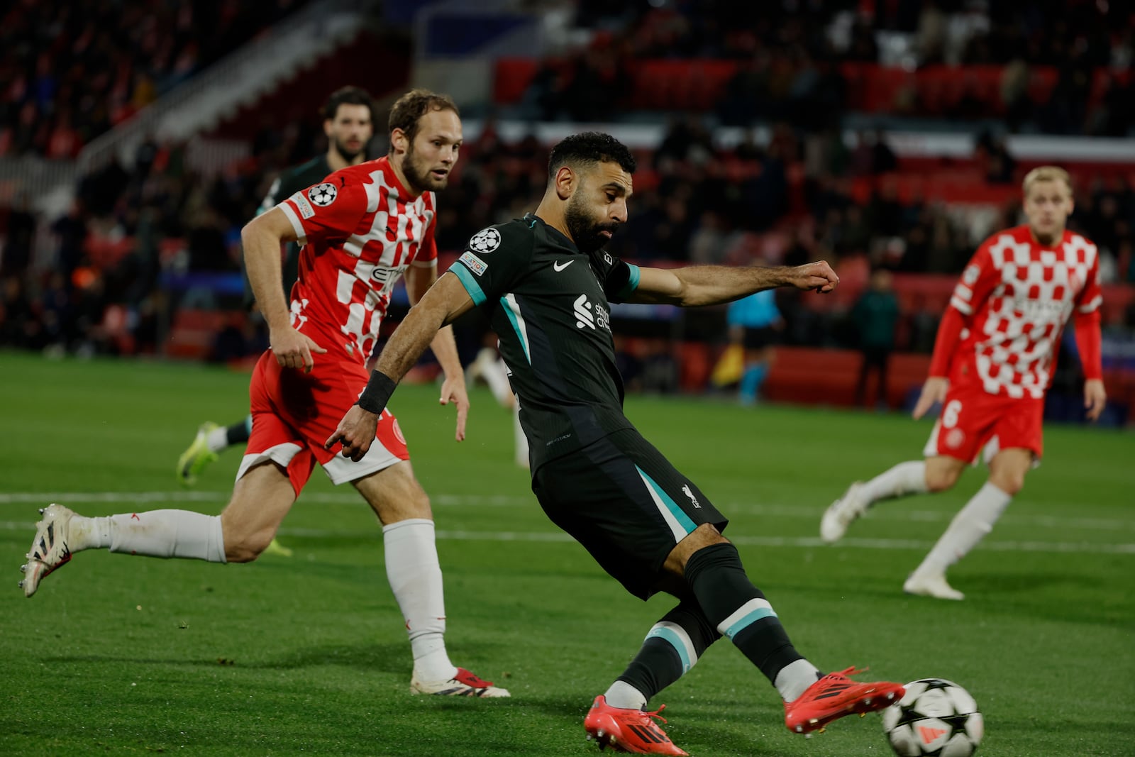 Liverpool's Mohamed Salah takes control of the ball during the Champions League soccer match between Girona and Liverpool at the Estadi Montilivi in Girona, Spain, Tuesday, Dec. 10, 2024. (AP Photo/Joan Monfort)