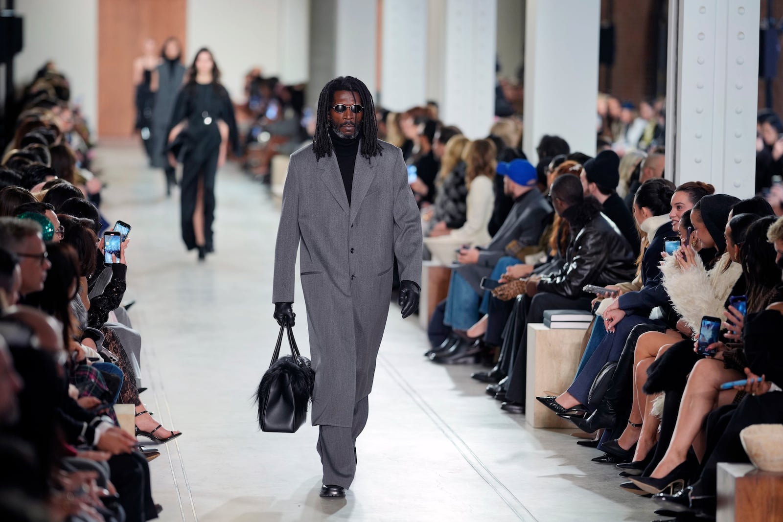 Models walk the runway during the Michael Kors Fall/Winter 2025 fashion show as part of New York Fashion Week on Tuesday, Feb. 11, 2025, at Terminal Warehouse in New York. (Photo by Charles Sykes/Invision/AP)