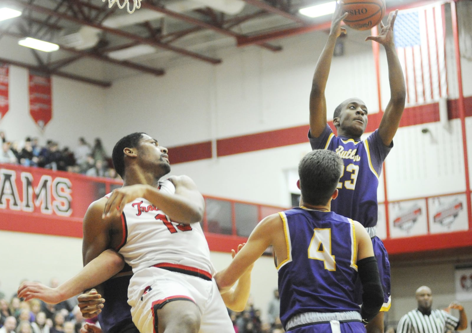 Butler’s Tyler Montague secures a rebound over teammate Braedon Norman (4) and Trotwood-Madison’s Justin Stephens (left). Trotwood defeated visiting Butler 94-76 in a boys high school basketball game on Friday, Jan. 11, 2019. MARC PENDLETON / STAFF