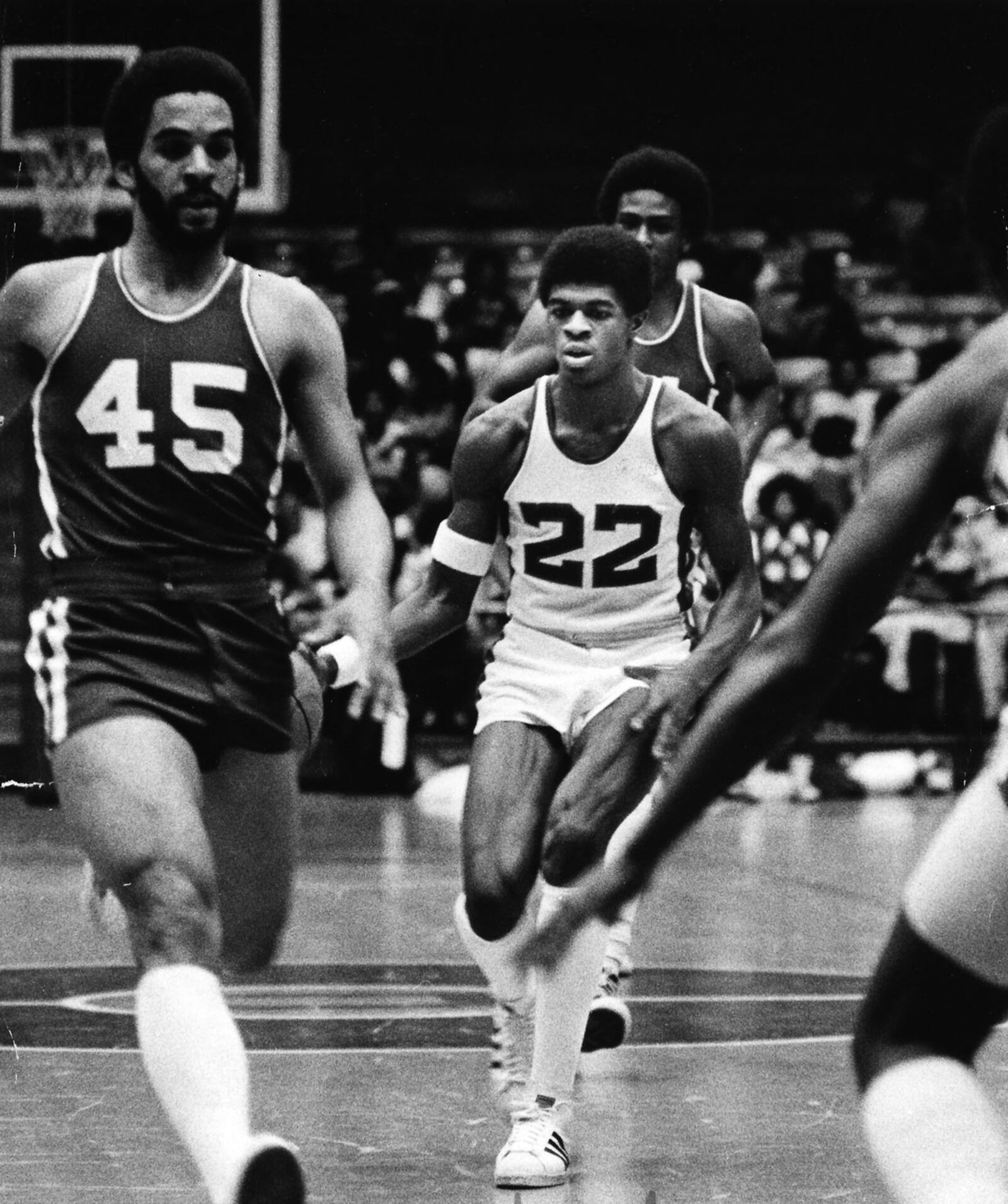 Dwight Anderson, #22, Roth High School, drives through traffic last against Dunbar back in 1978. DDN FILE