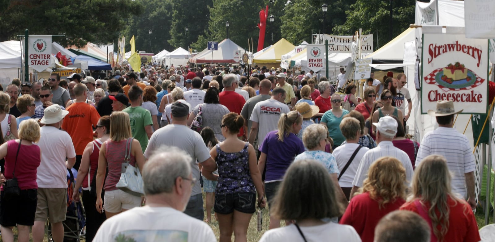 The Troy Strawberry Festival is one of many summer festivals in the region that draw big crowds of students and adults alike. CHRIS STEWART / STAFF