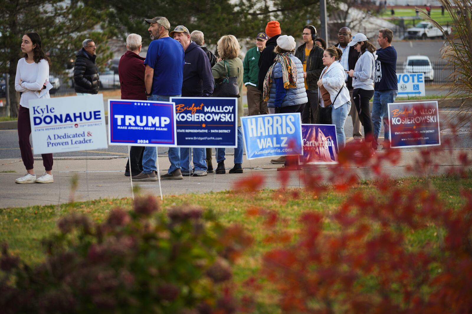 Voters wait in line to cast their ballots at Scranton High School in Scranton, Pa., on Election Day, Tuesday, Nov. 5, 2024. (AP Photo/Matt Rourke)