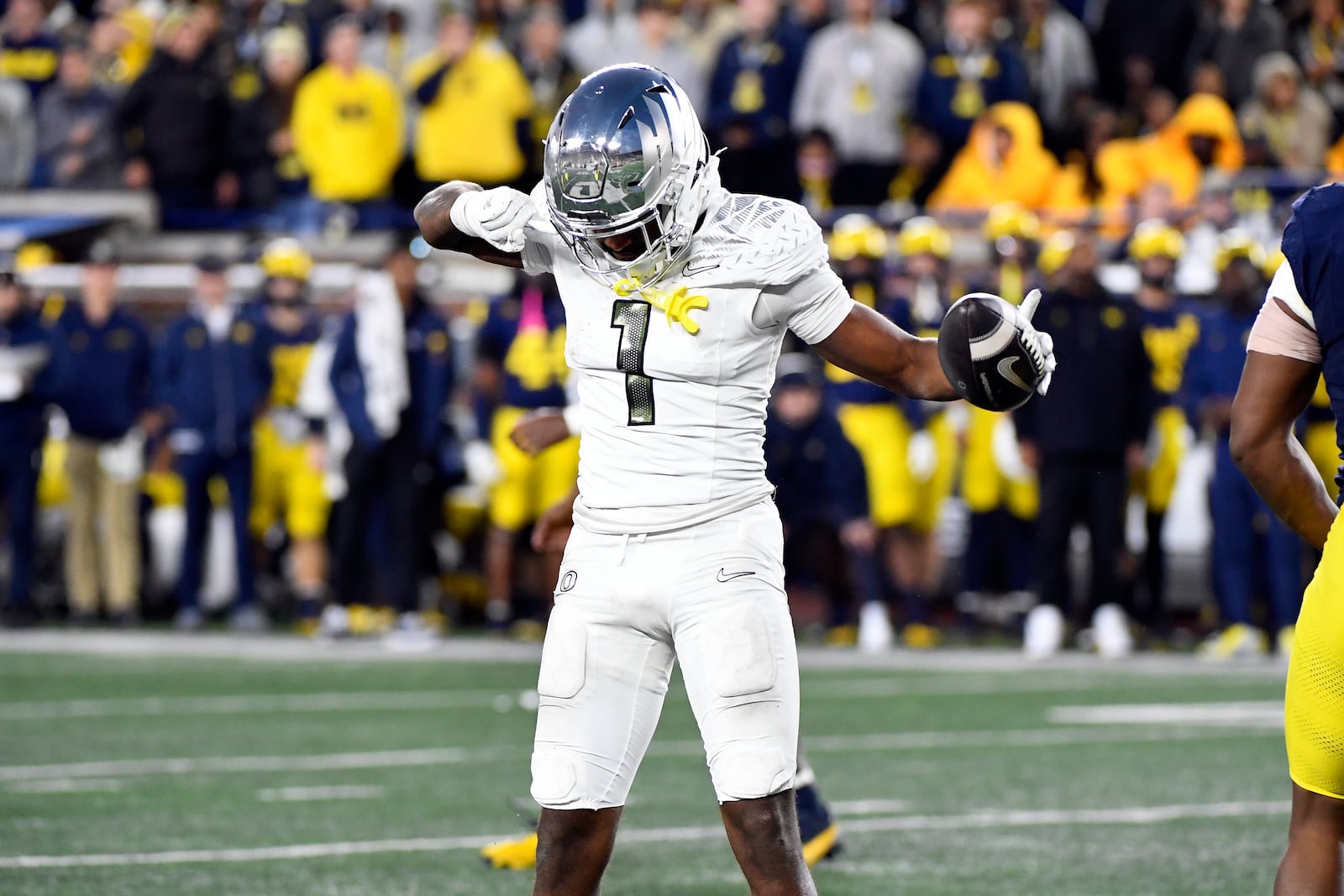 Oregon wide receiver Traeshon Holden reacts after making a catch for a first down against Michigan in the second half of an NCAA college football game, Saturday, Nov. 2, 2024, in Ann Arbor, Mich. Oregon defeated Michigan 38-17. (AP Photo/Jose Juarez)