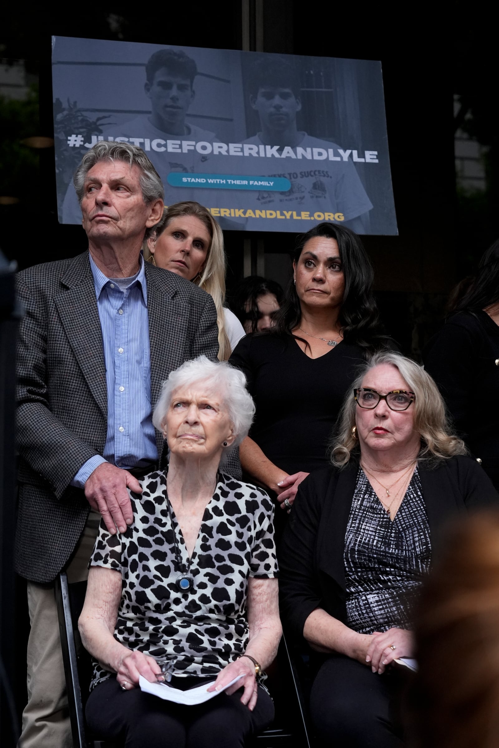 Kitty Menendez' sister, Joan Andersen VanderMolen, bottom left, and niece Karen VanderMolen, right, sit together during a press conference to announce developments on the case of brothers Erik and Lyle Menendez, Wednesday, Oct. 16, 2024, in Los Angeles. (AP Photo/Damian Dovarganes)