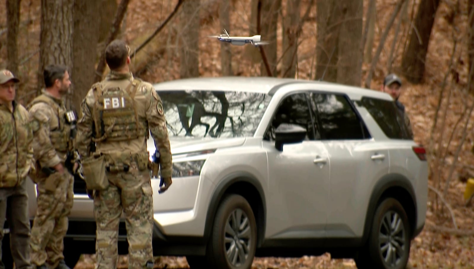 FBI agents search a neighborhood in Chapel Hill, North Carolina on Wednesday, Feb. 5, 2025 where Teresa Youngblut and Felix Bauckholt, who were involved in the shooting death of a U.S. Border Patrol agent in Vermont, had been renting homes in the neighborhood, their landlord told The Associated Press. (WRAL-TV via AP)