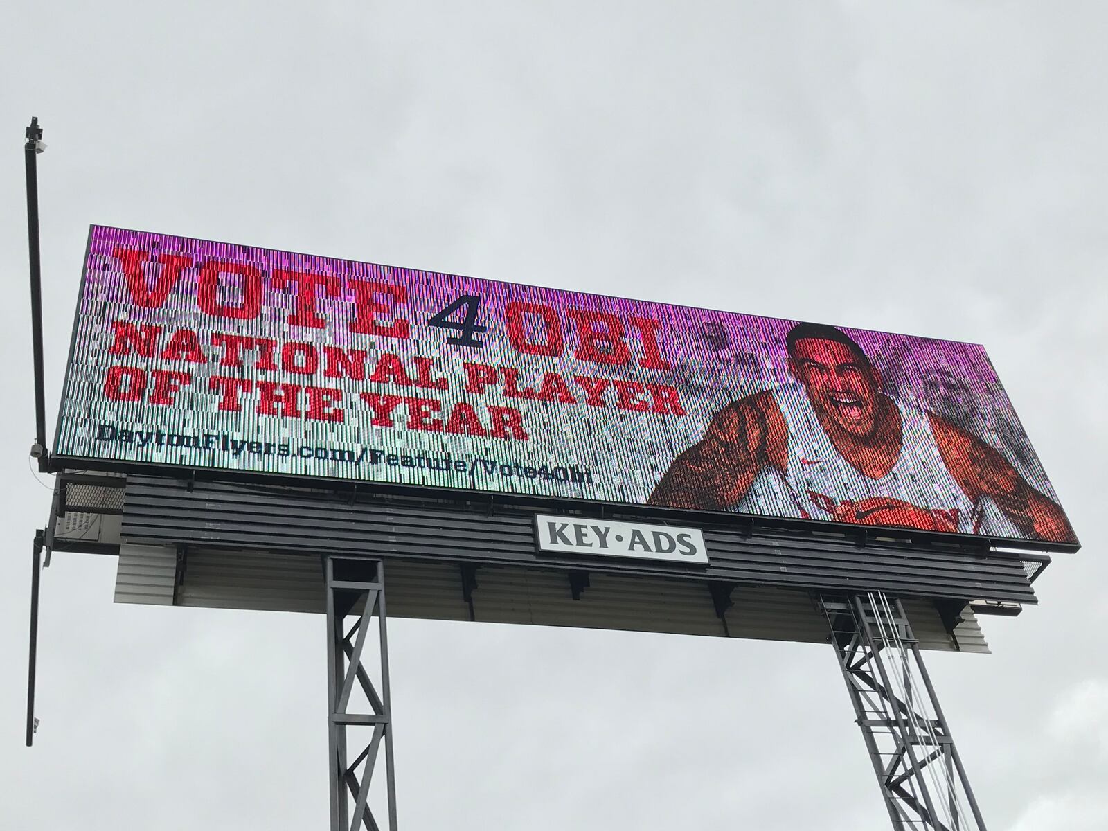 A billboard on Interstate 75 near UD Arena features Dayton's Obi Toppin.