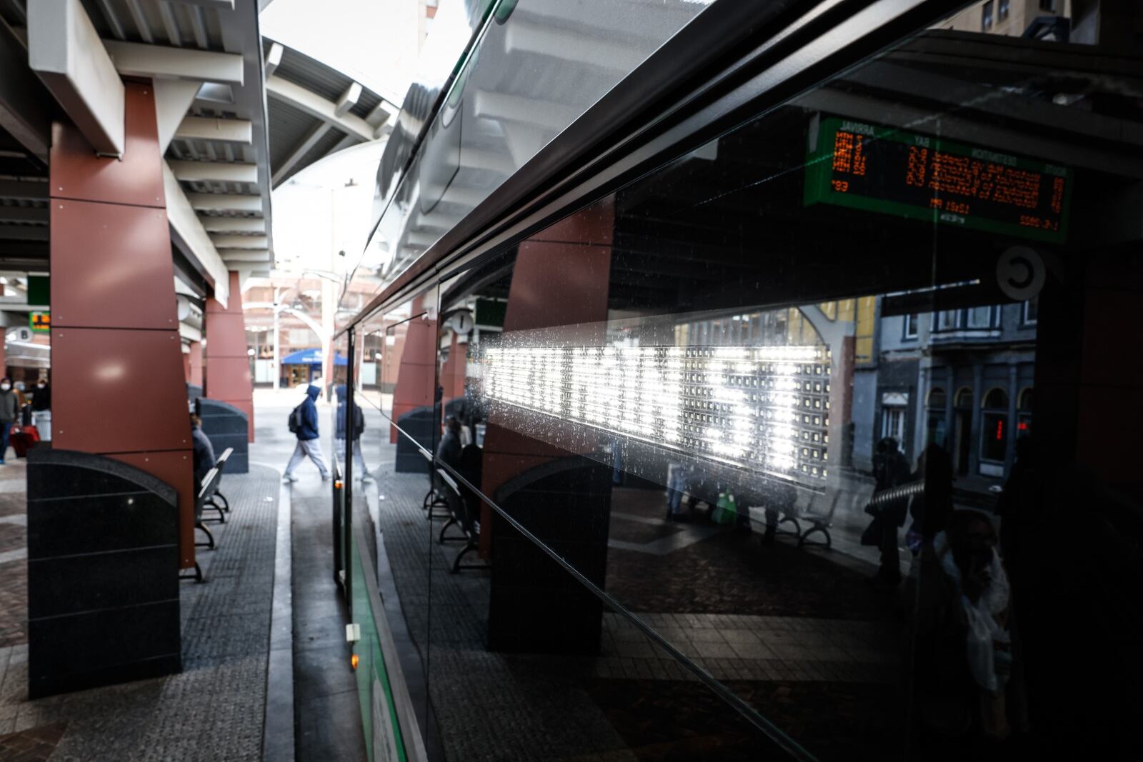 The RTA Hub on Main St. was busy on Wednesday with people coming and going to work. The Greater Dayton Regional Transit Authority announced it will temporarily reduce service because of rising absences likely due to COVID and lower ridership during the public health crisis.  JIM NOELKER/STAFF