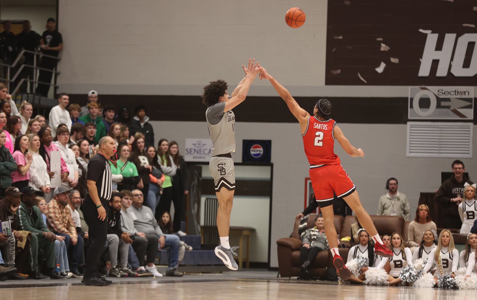 St. Bonaventure's Lajae Jones shoots a 3-pointer against Dayton's Nate Santos in the first half on Tuesday, Jan. 28, 2025, at the Reilly Center in St. Bonaventure, N.Y.. David Jablonski/Staff