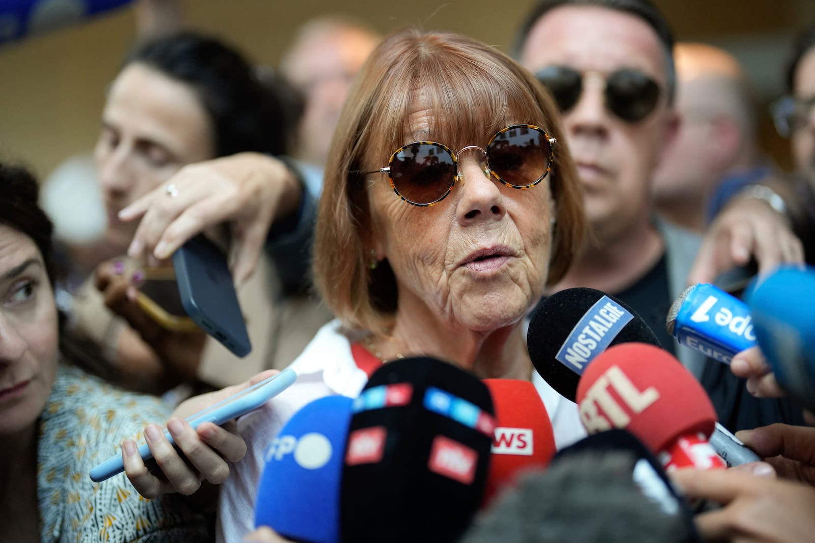 FILE - Gisele Pelicot speaks to media as she leaves the Avignon court house, southern France, Thursday, Sept. 5, 2024. (AP Photo/Lewis Joly, File)