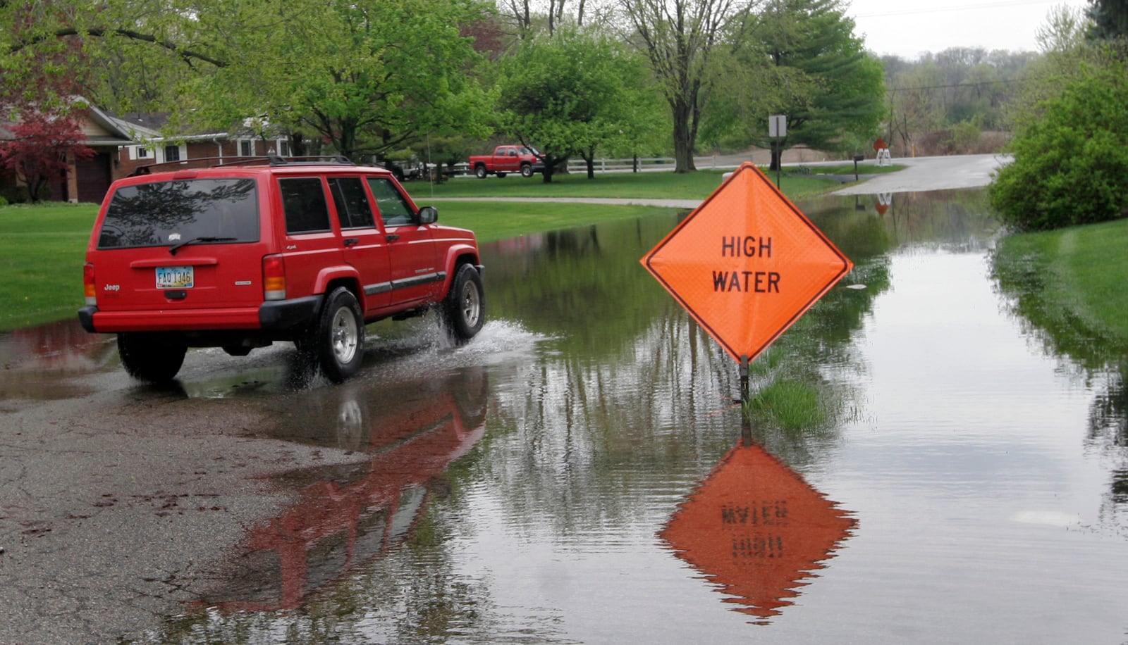 FILE: Beavercreek may consider using American Rescue Plan funds on a stormwater projects, including one to ease persisent flooding on Willowcrest Road, pictured here in 2011. LISA POWELL / STAFF FILE